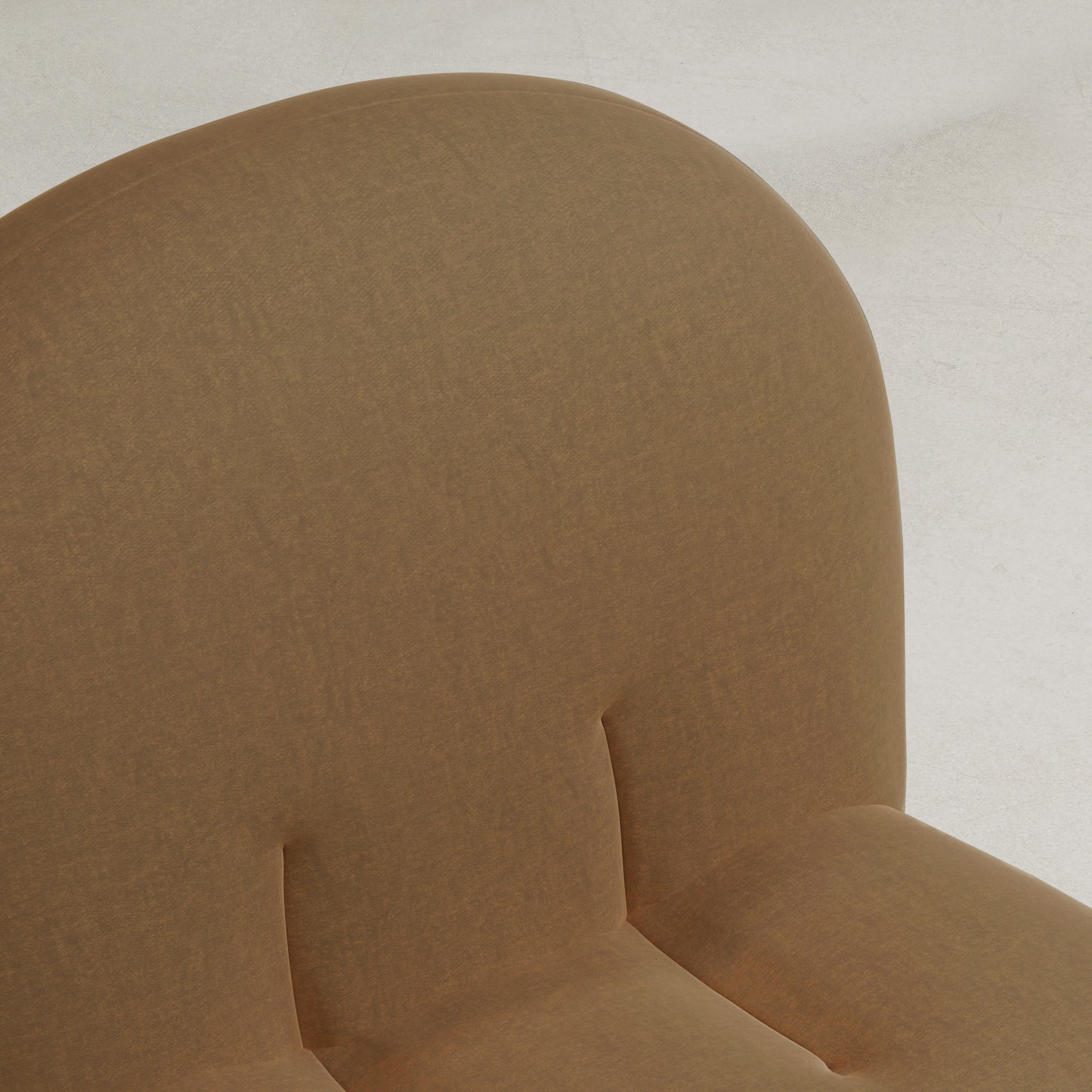 Close-up of the Colette Chair’s upper section, featuring a brown upholstered finish with a rounded backrest and two vertical stitched seams, highlighting its rich texture against a light background.