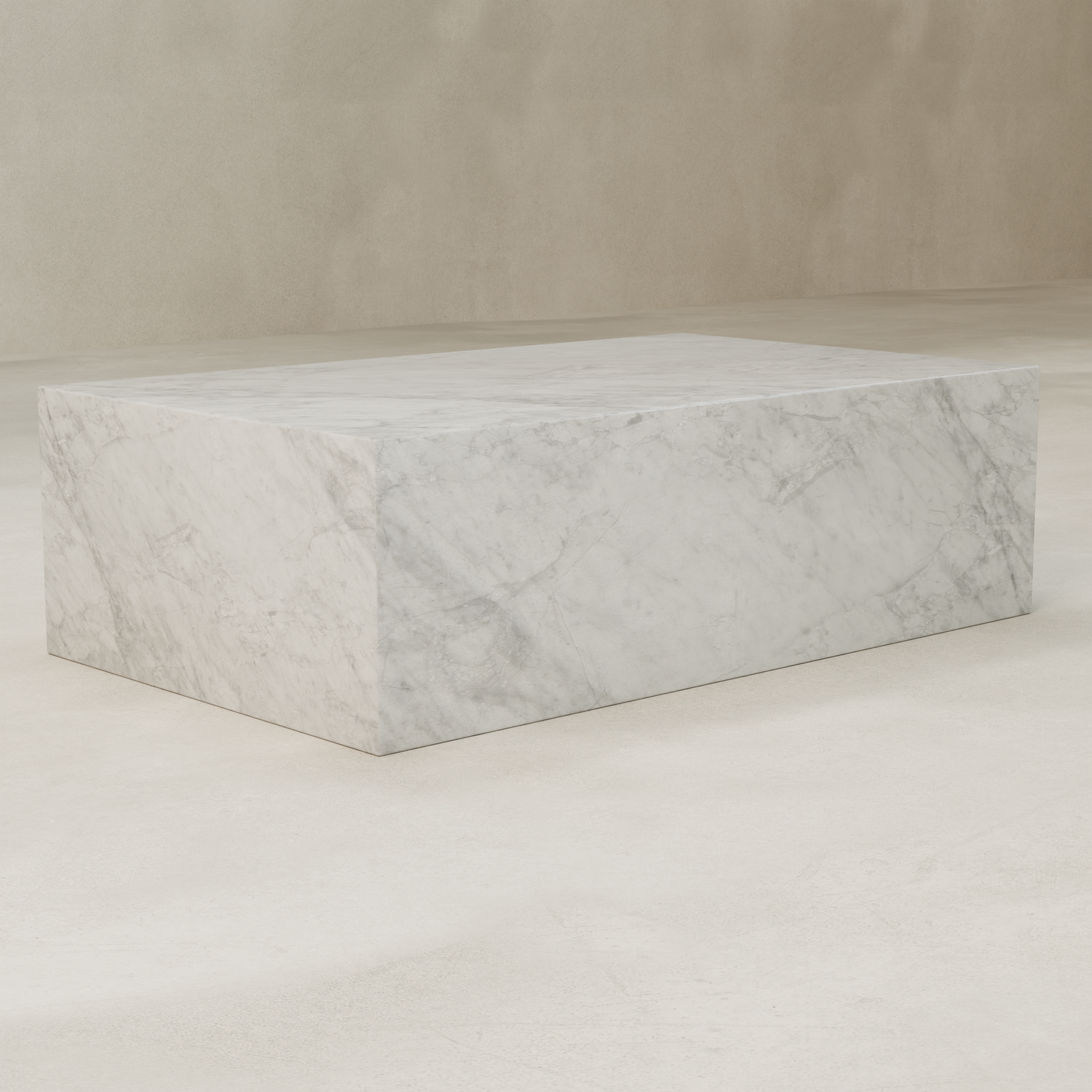 The Griselle Marble Coffee Table, featuring a large rectangular design with elegant gray veining, rests on a smooth, light-colored floor by a simple beige wall.