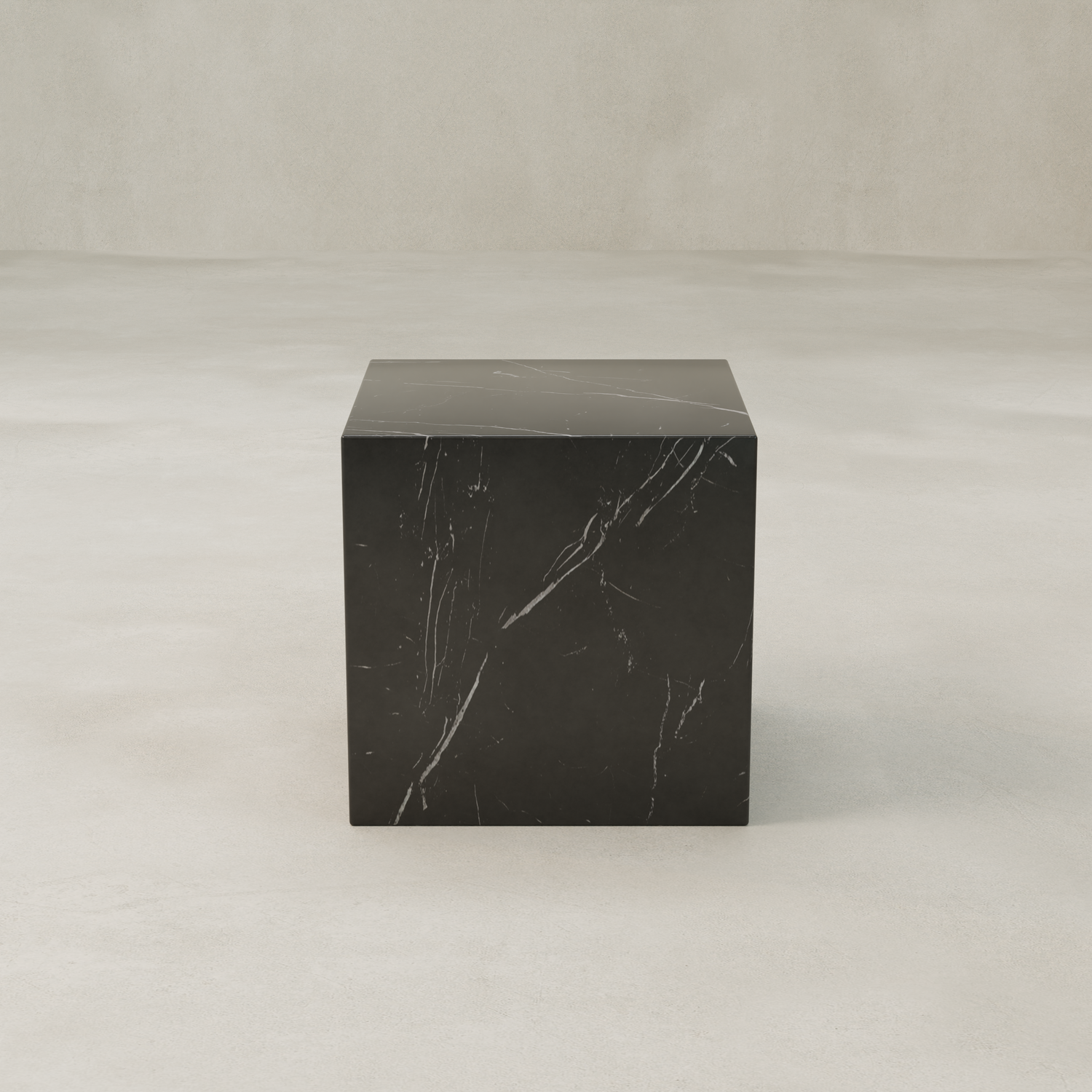 The Obscara Nero Marquina Marble Plinth - Cube features striking black marble with subtle white veining, standing elegantly on a smooth surface against a neutral backdrop for a look of timeless sophistication.