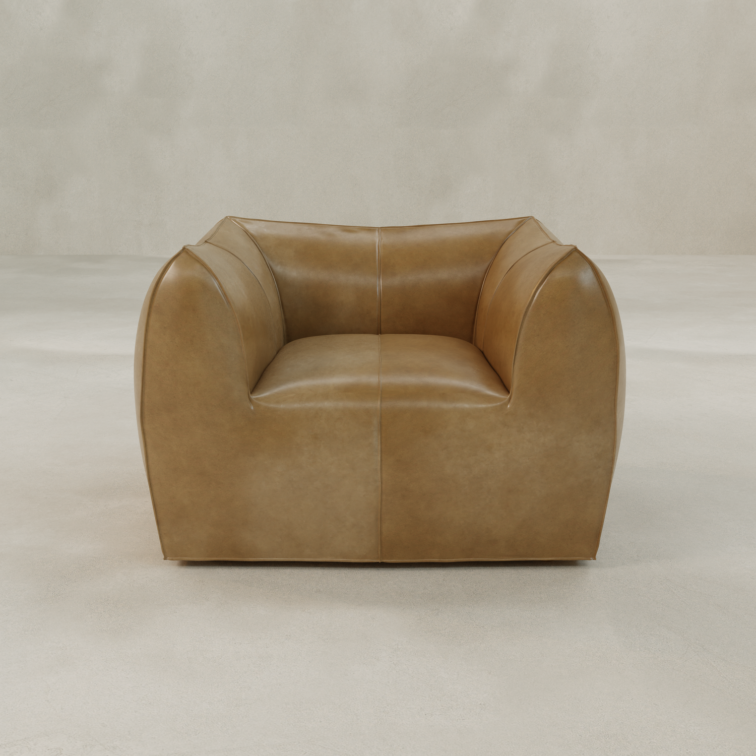 The Bambon Armchair, featuring vintage leather upholstery, wide arms, and a low back, offers a clean, contemporary look. Its modern boxy design stands out on a light floor against a neutral backdrop.