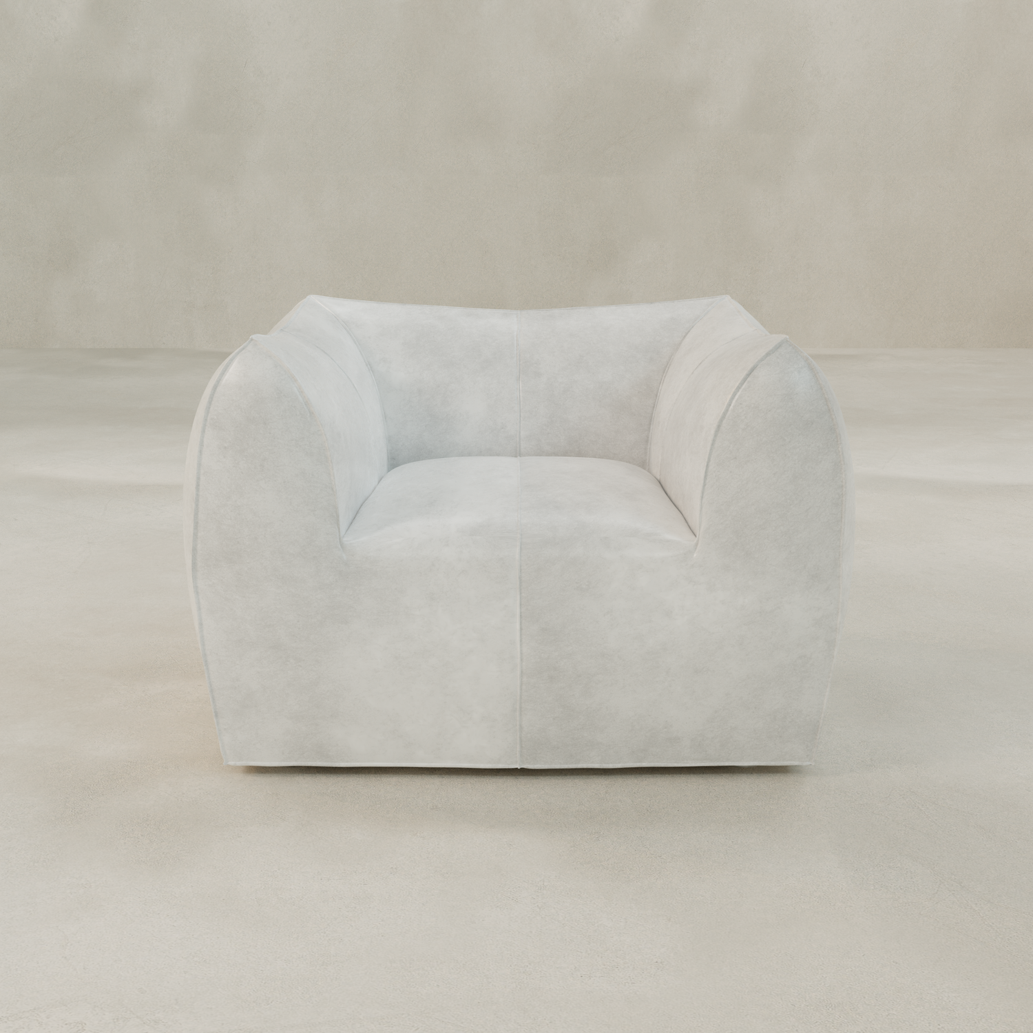 The Bambon Armchair features a modern, wide design with soft, natural curves and light gray upholstery, set on a smooth, neutral floor against a matching plain background.