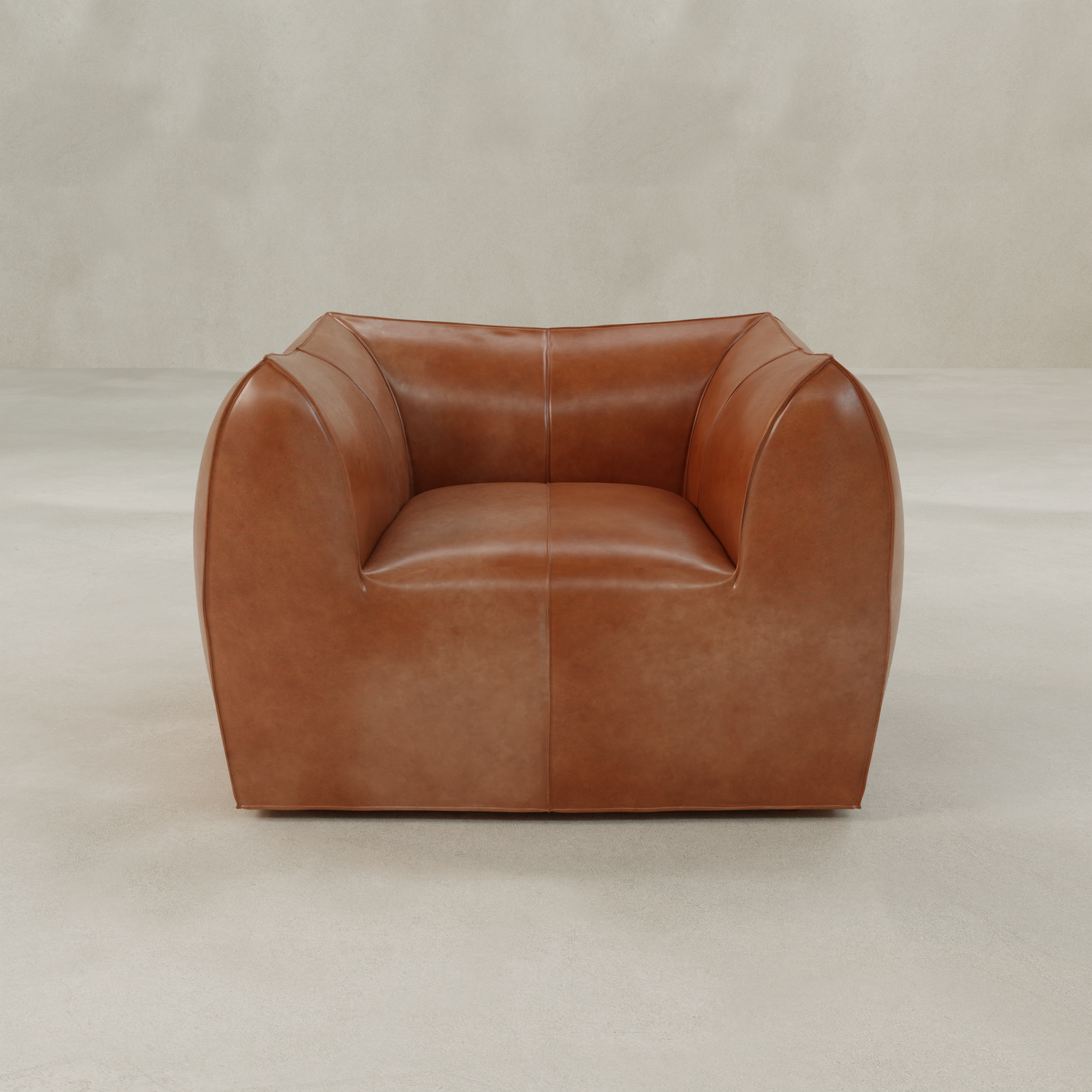 The Bambon Armchair, with its modern boxy shape, wide arms, low back, and smooth vintage leather upholstery, stands out against a light neutral background. Minimal seams and a contemporary design complete its stylish look.