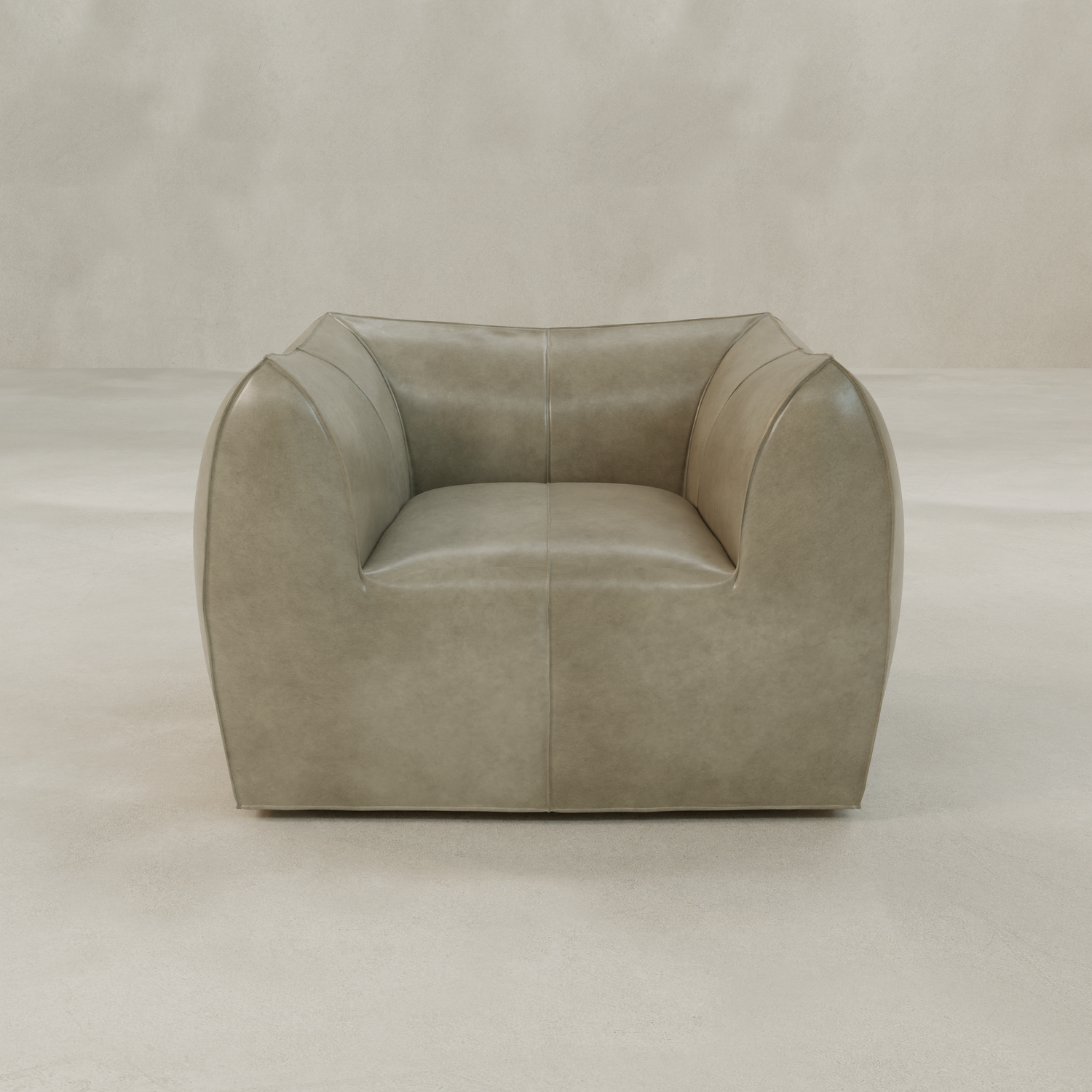 The Bambon Armchair is a modern, boxy seat with taupe vintage leather upholstery, wide armrests, and a low backrest, shown against a light neutral background.