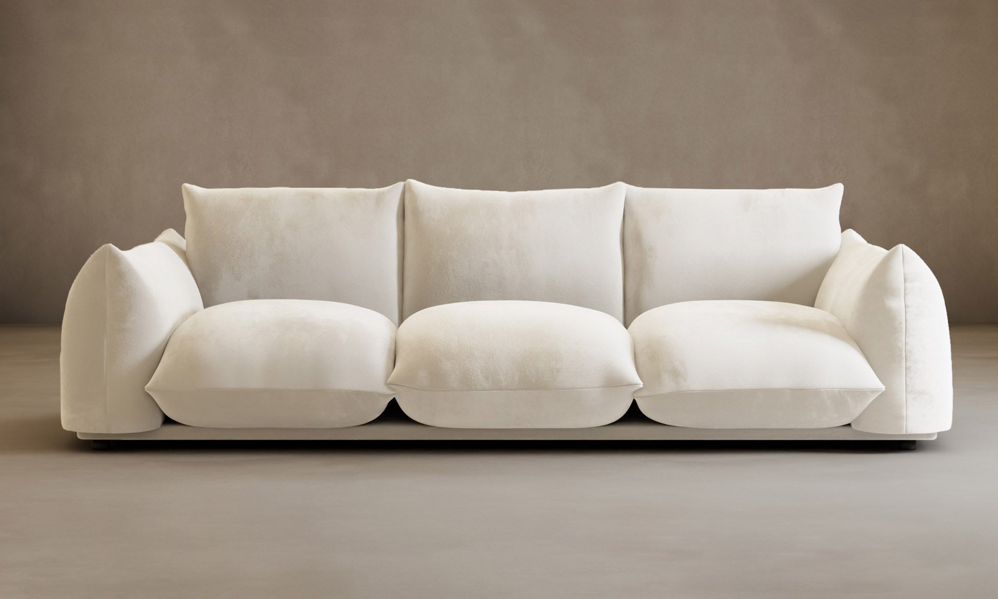 The Calypso Three Seater Sofa adds modern elegance to your home with its minimalist white design, three spacious seat cushions, and back pillows.