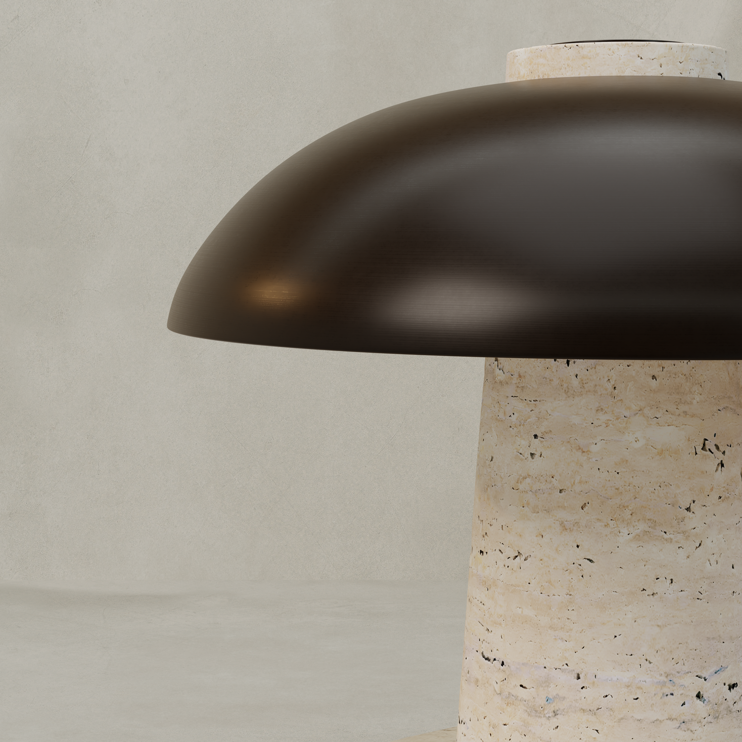 A close-up of the Chiara Lamp, showcasing its dark, dome-shaped metal shade and cylindrical beige travertine base against a plain light gray background.