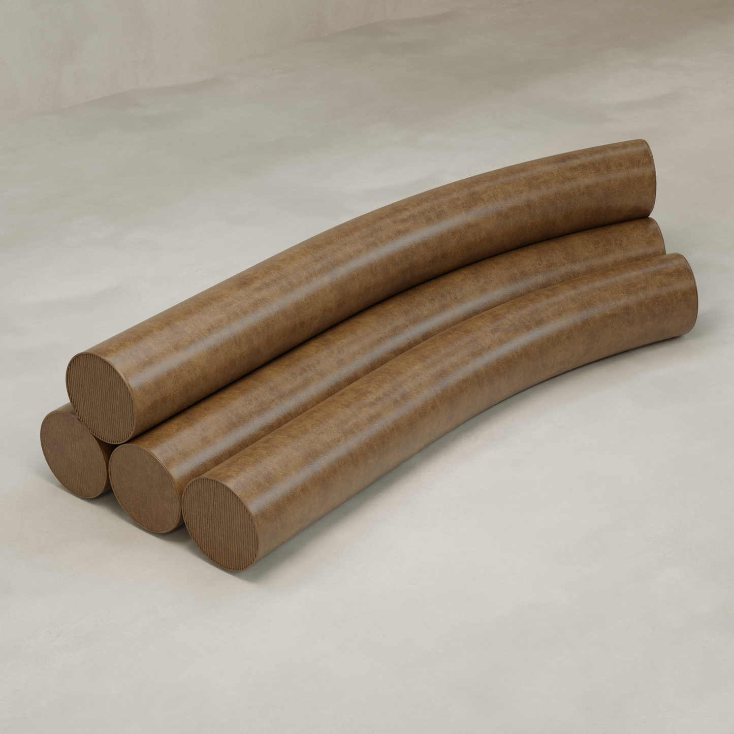 Four large, brown Cylindra Sofas with a smooth, leather-like finish are arranged in a staggered stack on a light floor, echoing the playful forms typical of neotenic sofa design.