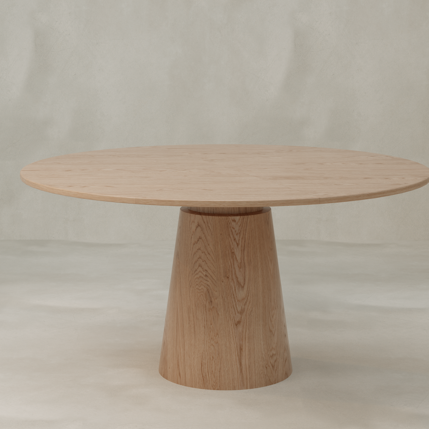 The Harlow Dining Table showcases a natural wood finish, smooth round surface, and a striking conical pedestal base, beautifully presented against a neutral textured backdrop.