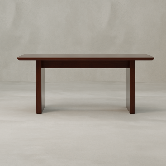 The Kensington Dining Table, featuring a rectangular dark brown wooden top and ribbed legs, stands on a light-colored floor against a simple neutral backdrop.