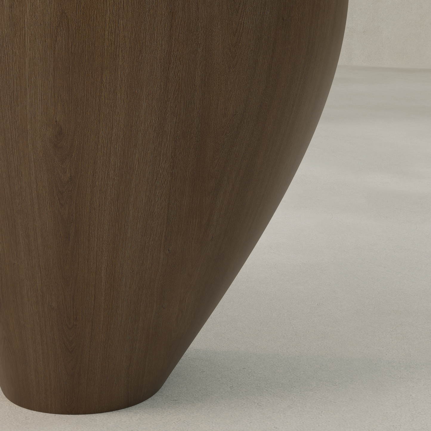 The Noyer Side Table features a tall, curved wooden design with a smooth dark brown finish, showcasing modern artistry. This sculptural piece rests on a light-textured surface, blending elegance and function in contemporary décor.