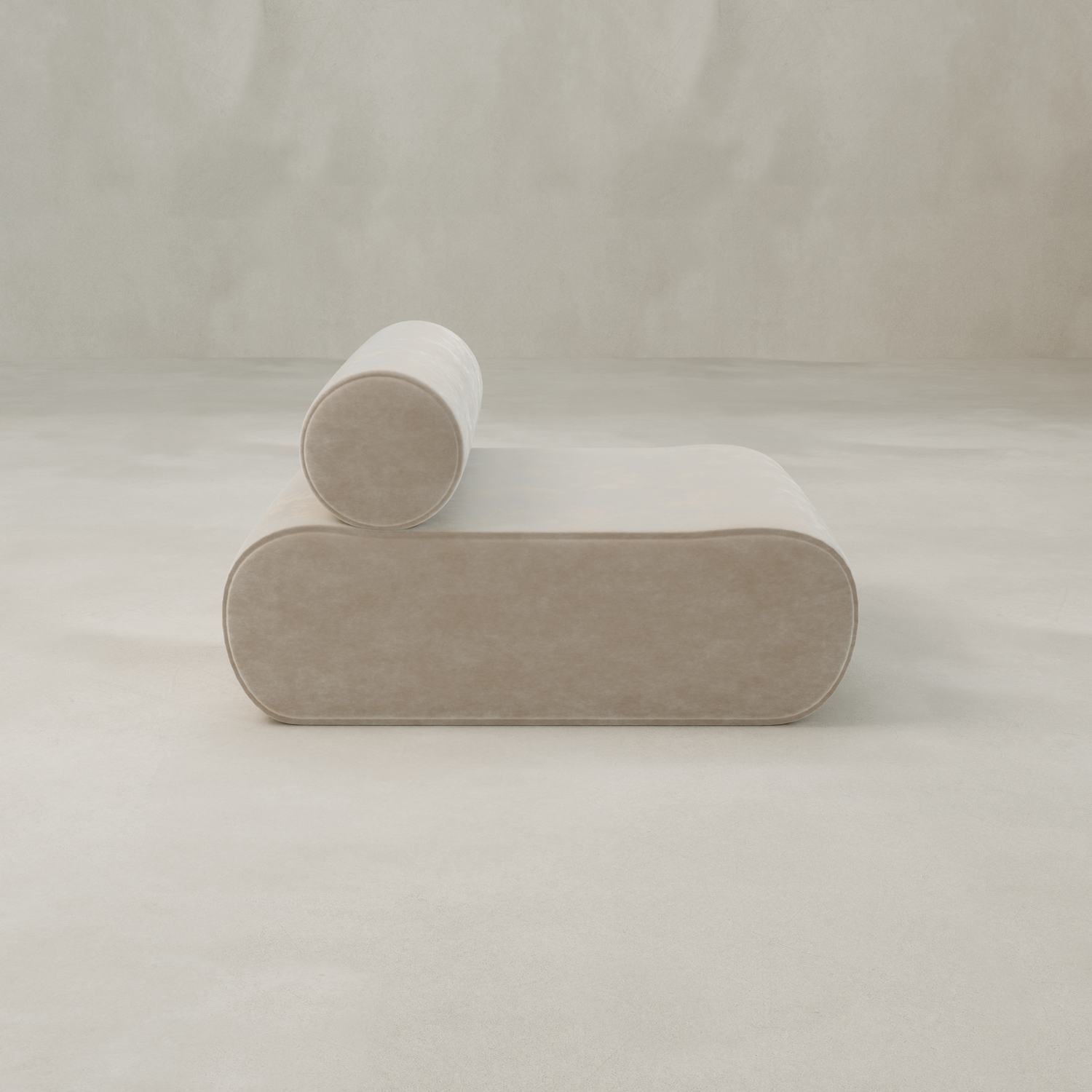 The Nuage Modular Lounge Chair, a minimalist light beige seat in textured boucle with a cylindrical backrest, sits on a smooth neutral-toned floor against a plain background, creating a subtle sculptural statement.