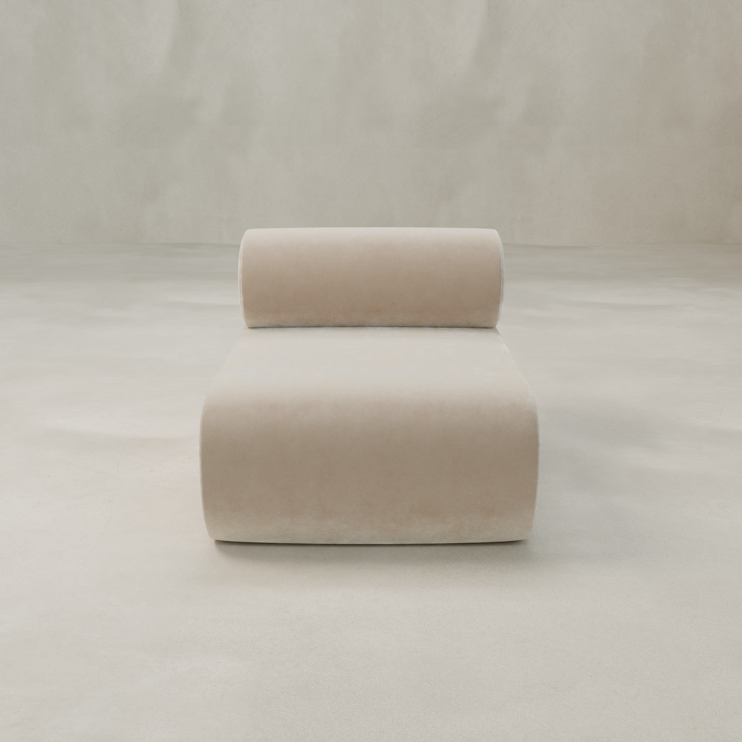 The Nuage Modular Lounge Chair in beige textured boucle, featuring a cylindrical backrest, adds a sculptural touch to any light, spacious room with smooth neutral walls and flooring.