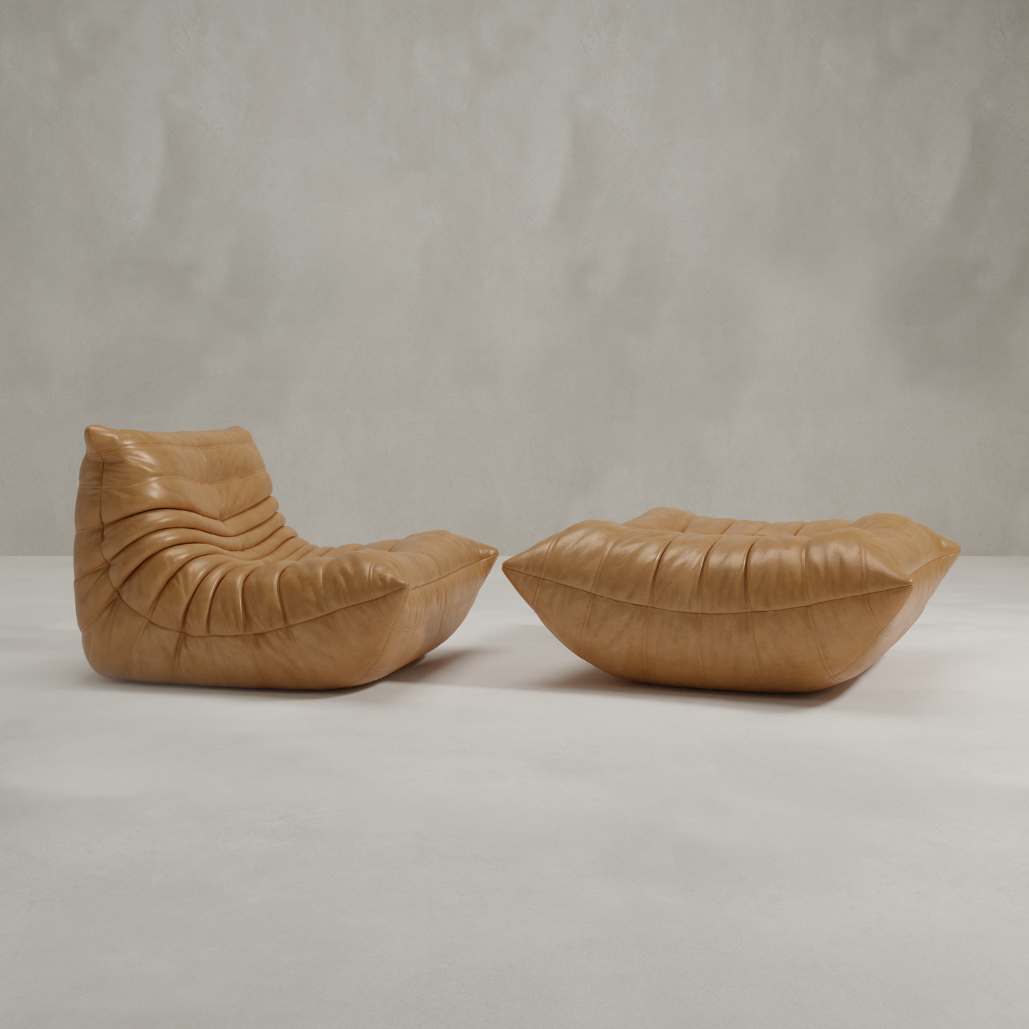 The Rolo Lounge Sofa Chair with Ottoman features modern tan leather, a low slouched silhouette, and horizontal tufting that evokes mid-century style, set on a light floor against a neutral textured backdrop.