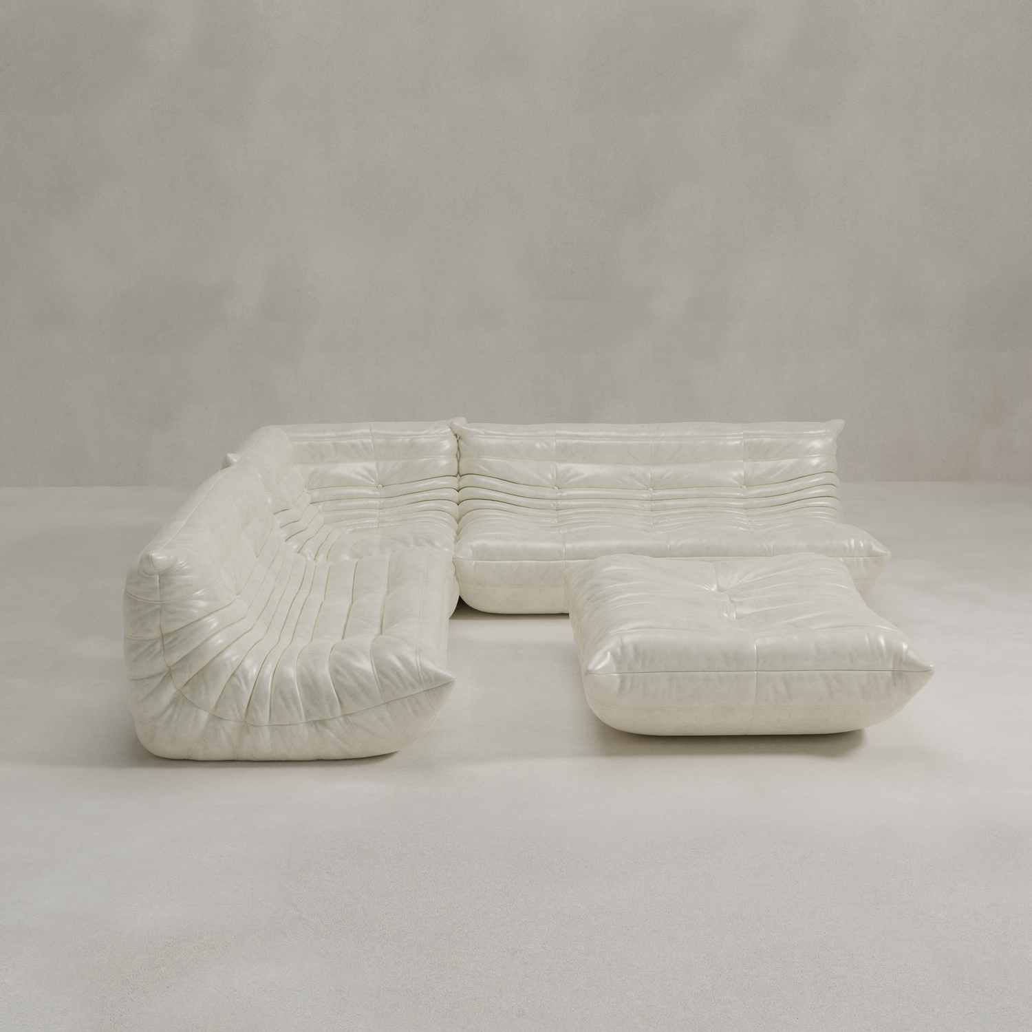 The Rolo Lounge Four Piece Sofa is a modern, white, tufted sectional with deep seats, an ottoman, and a modular design, shown against a plain light grey background.