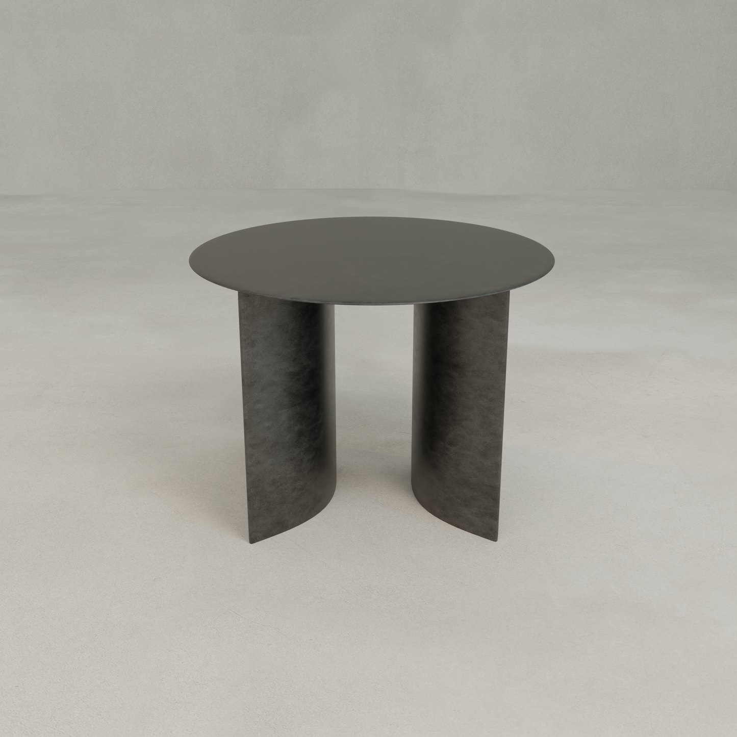 The Roma Coffee Table Short is a modern, round black table with elegant two curved panel legs, set on a light gray floor and against a plain light gray background—ideal for sophisticated decor.