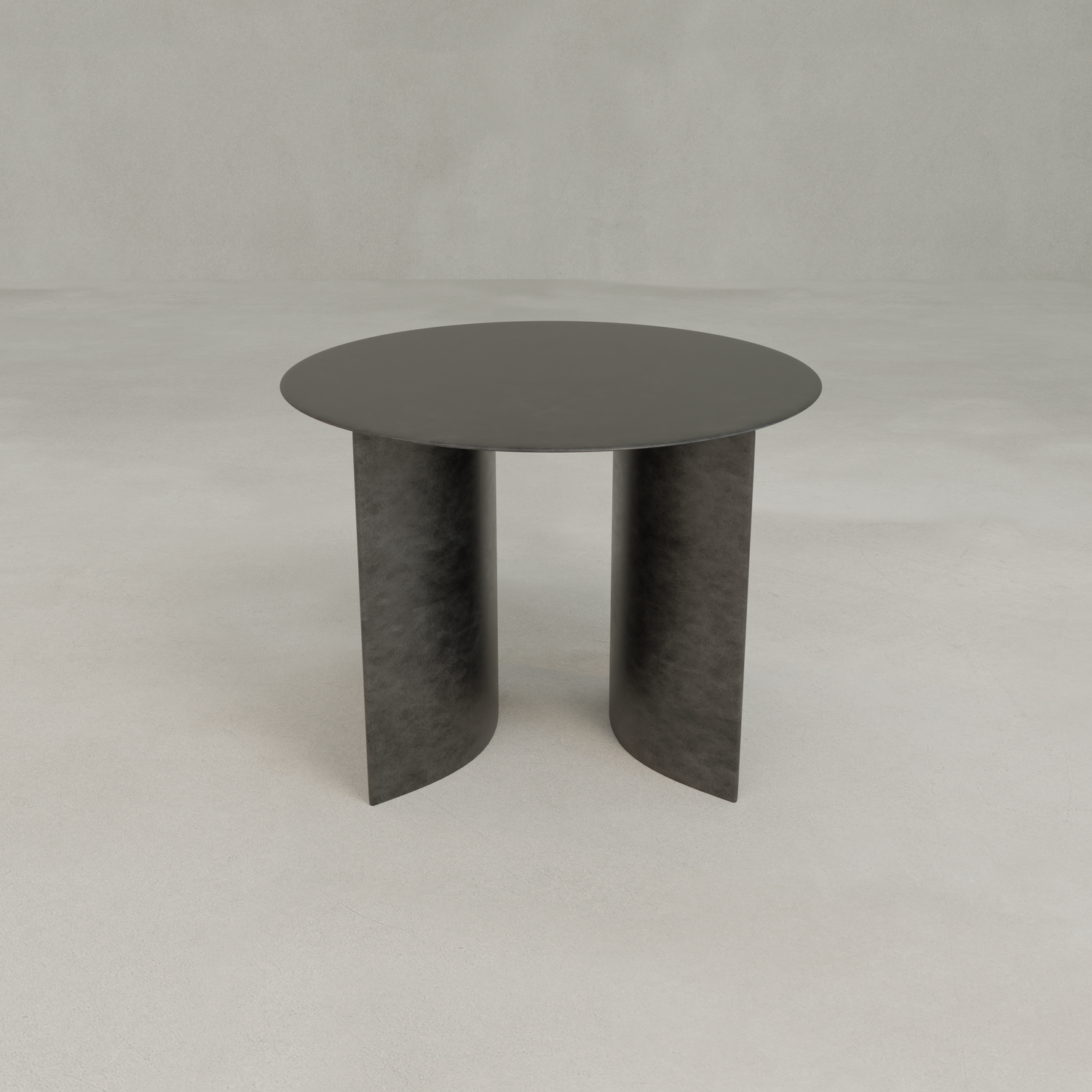 The Roma Coffee Table Short is a modern, round black table with elegant two curved panel legs, set on a light gray floor and against a plain light gray background—ideal for sophisticated decor.
