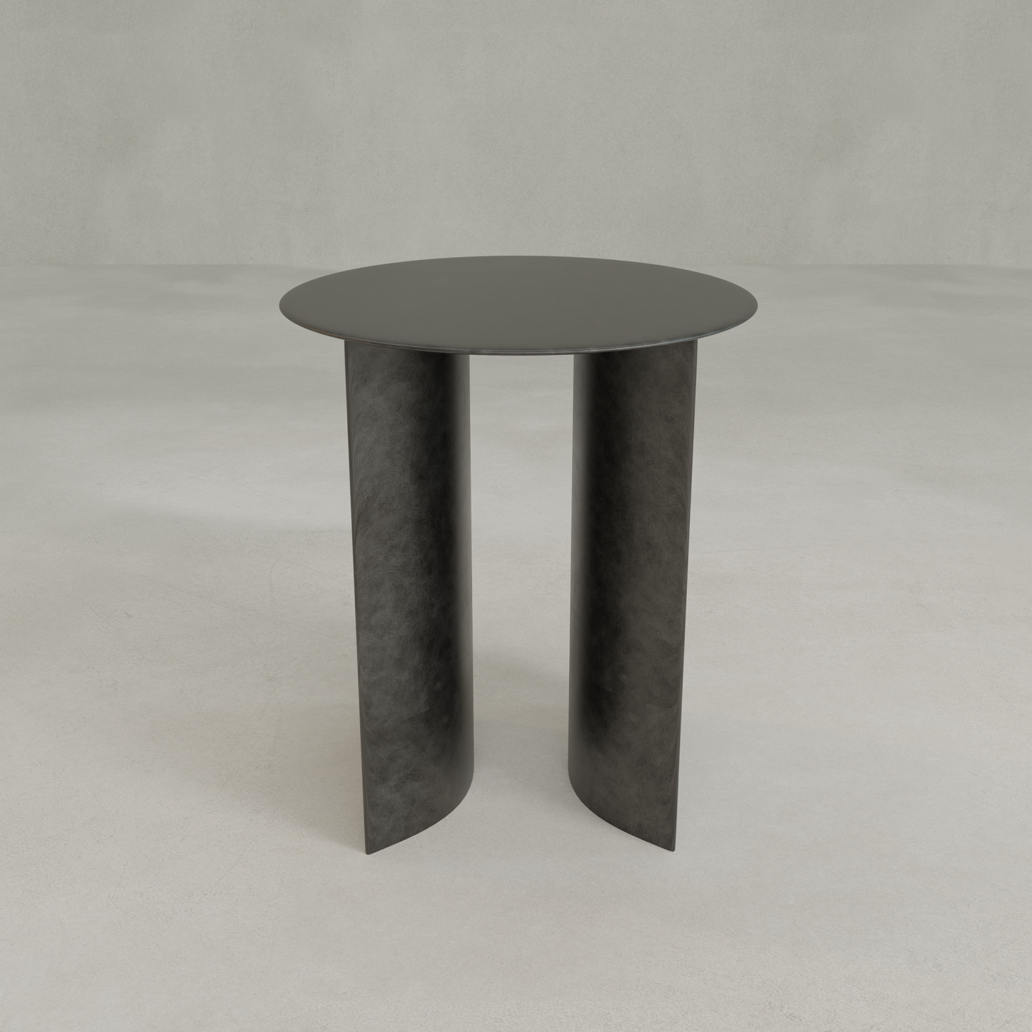 The Roma Coffee Table Tall features a modern, minimalist design with a round black top and two curved vertical legs, ideal for those seeking elegant and functional furniture. Shown on a light gray floor with a plain gray background.