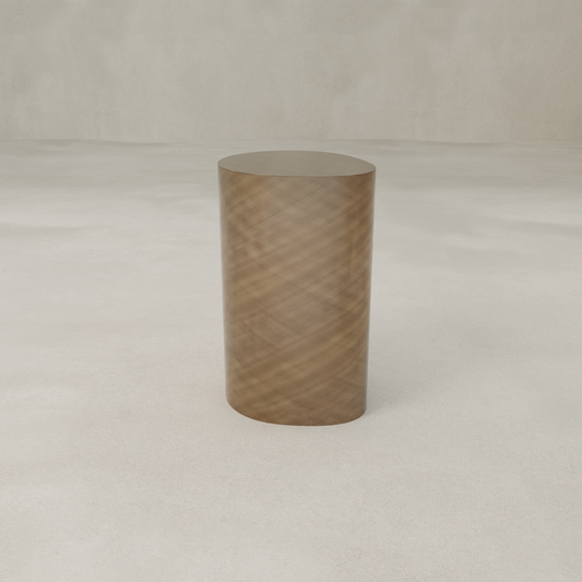The Solaris Side Table Organic features a cylindrical wooden form with a subtle diagonal pattern, showcased on a light floor and set against a neutral background.