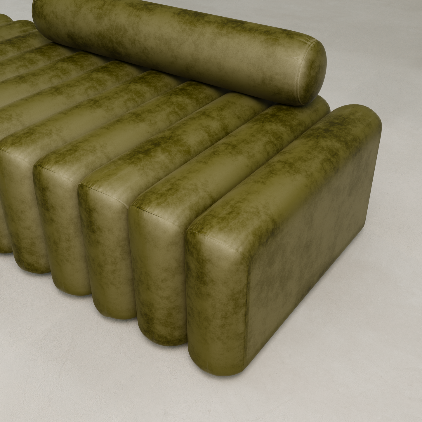 The Sonorra Bench Large is a modern olive green modular sofa with quilted velvet upholstery, cylindrical backrest, and ribbed cushions, set on a light-colored floor.
