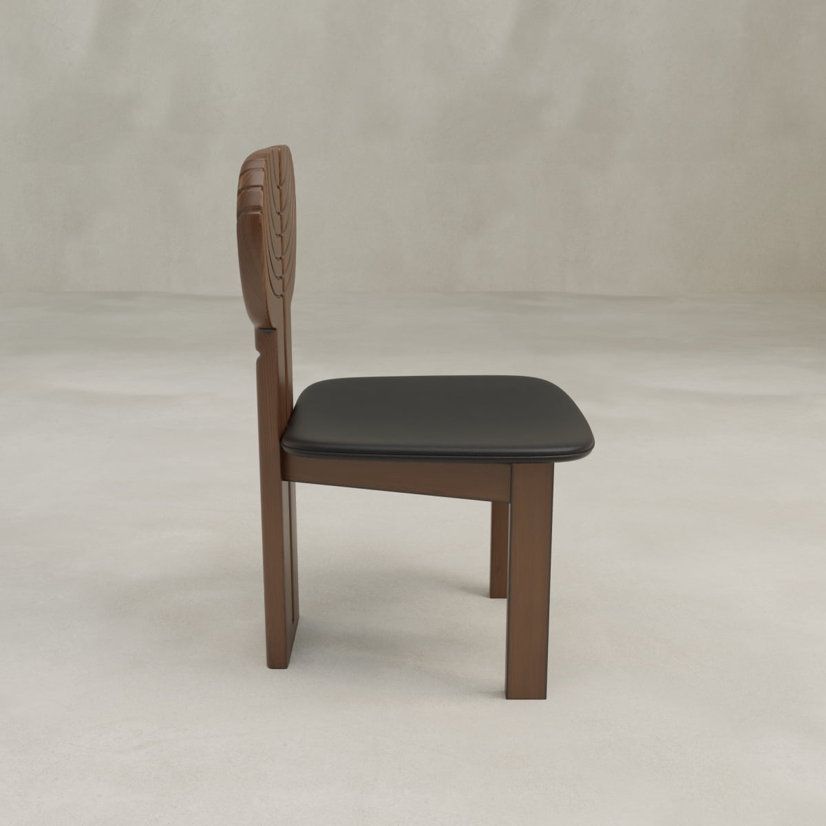 The Arnaud Dining Chair features a carved wooden backrest and black cushioned seat, creating a modern look ideal for dining spaces. Shown in profile against a plain, light background.