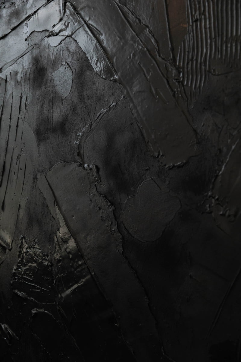 Handcrafted textured black canvas art by Art By Suzette Newman features overlapping brushstrokes with glossy and matte finishes, creating a moody, dramatic look—ideal for those seeking premium-quality wall decor.