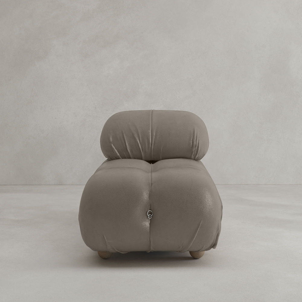 A modern Belmont Chair 2/3Rd Modular Sectional with soft, tufted taupe upholstery, rounded edges, and a low-profile modular design set against a plain light gray background.