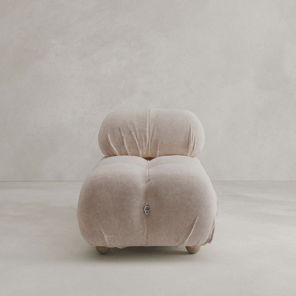 The Belmont Chair 2/3Rd Modular Sectional features a plush, modern armless design with light beige upholstery, soft tufting, and rounded edges—perfect for versatile combinations in any setting.