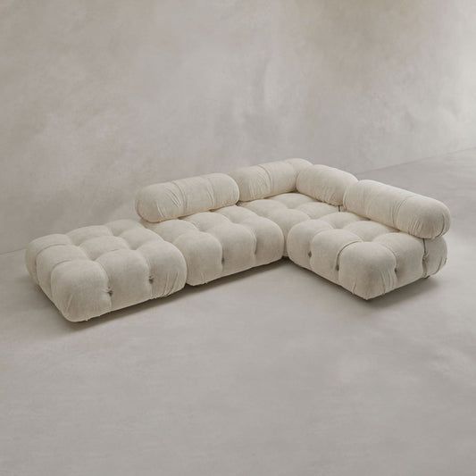 The Belmont Sofa Combination C features modern, low-profile design with marshmallow-like curves and tufted, cushiony seats and backs in soft beige fabric, shown against a plain, light-colored background.