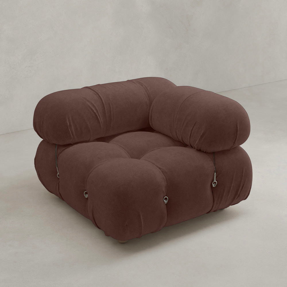 The Belmont Sofa Left Armrest features deep brown, tufted plush upholstery and rounded, marshmallow-like curves, displayed against a plain light-colored background.