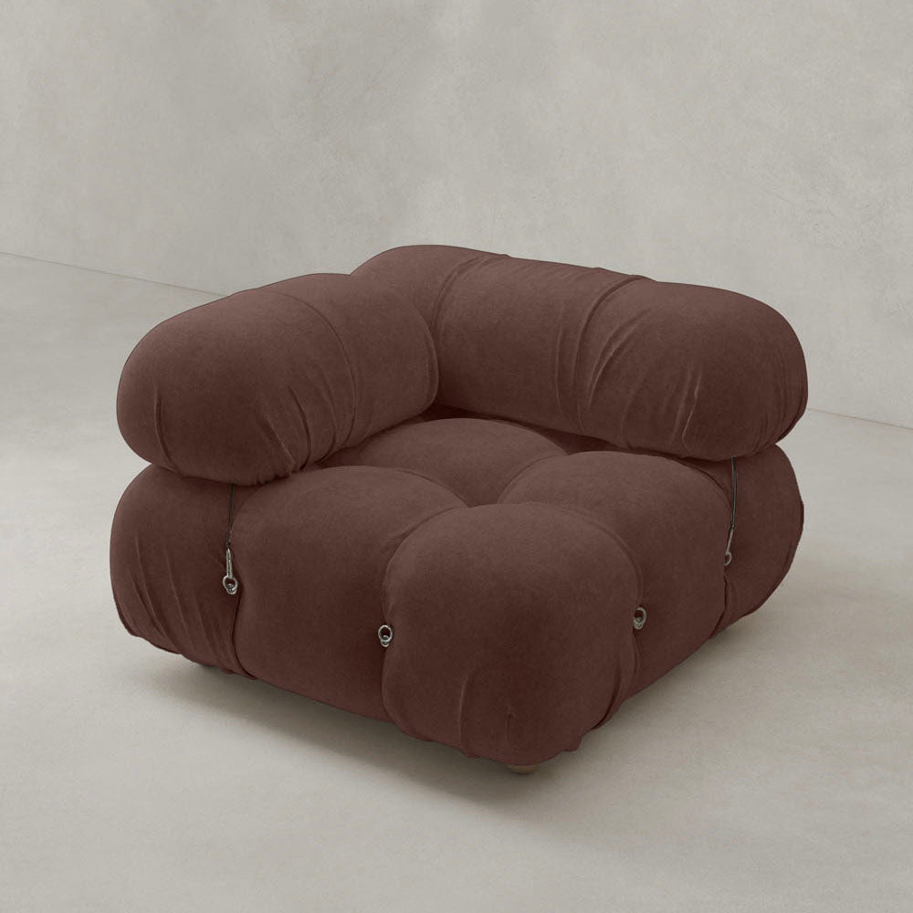 The Belmont Sofa Right Armrest features modern, low-profile design with plush, tufted brown upholstery and rounded edges, set against a plain light-colored background.
