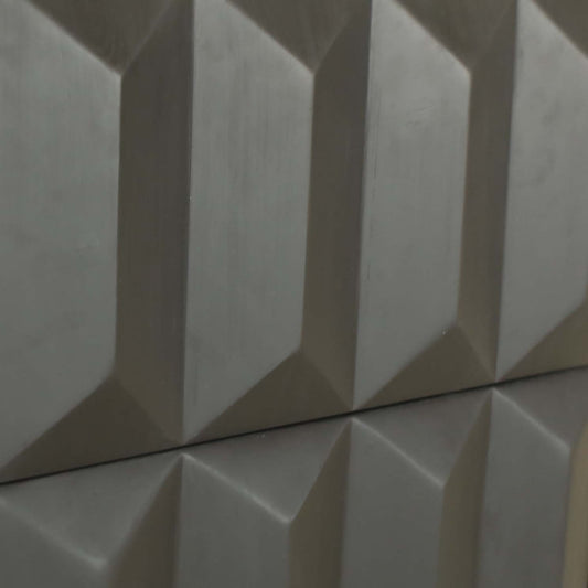 Close-up of the Braemar Console’s metallic surface, showcasing a repeating pattern of raised, three-dimensional diamond shapes in grey—a distinctive detail inspired by avant-garde design.