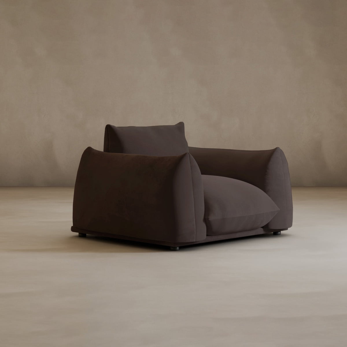 The Calypso Arm Chair stands out in this minimalist space, its plush upholstery and modern design bringing warmth and comfort against a neutral backdrop.