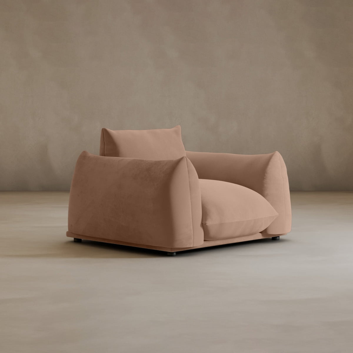 The Calypso Arm Chair is a modern, oversized chair with plush light brown upholstery and rounded edges, providing comfort as it rests on a neutral floor with a matching background.