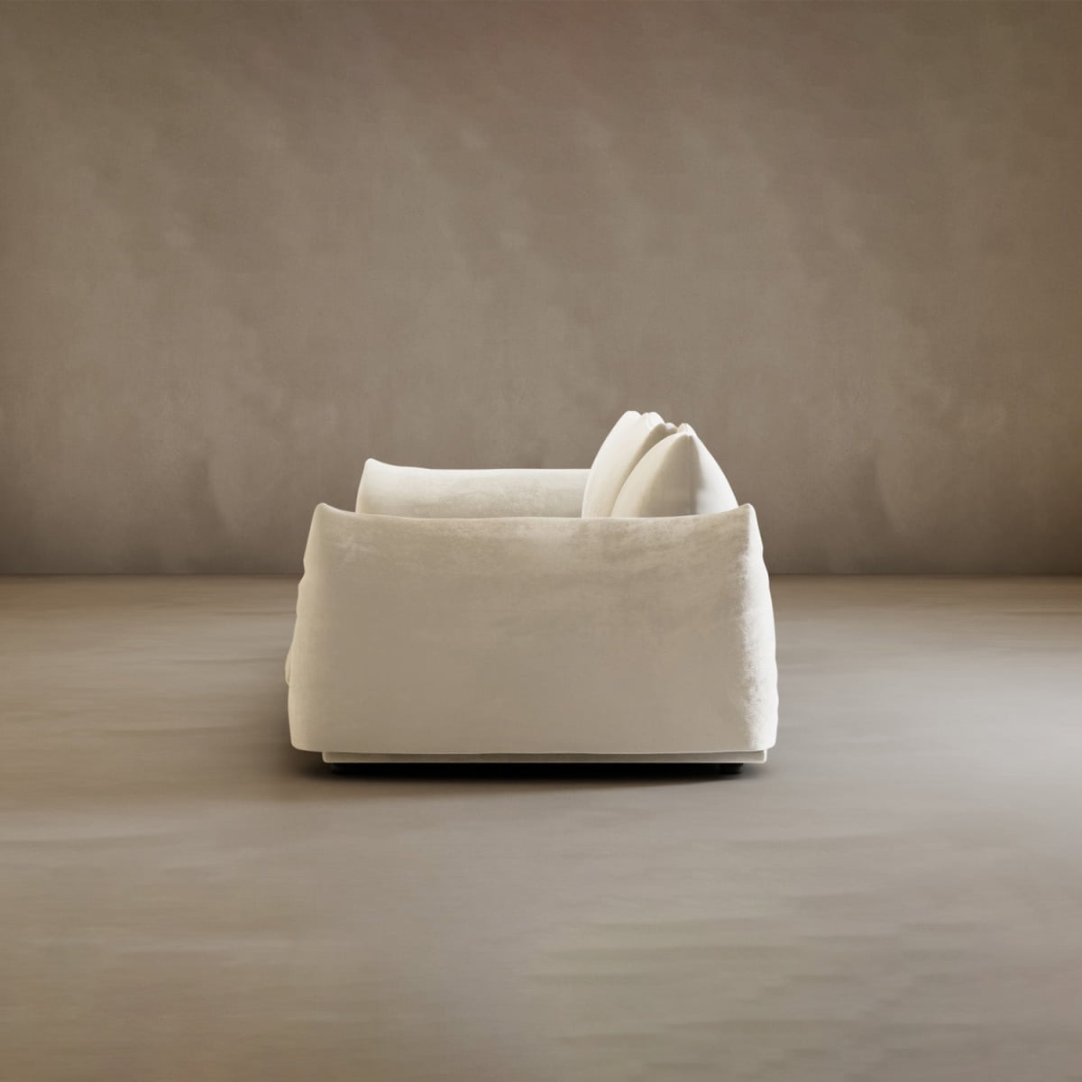 The Calypso Three Seater Sofa, in sleek white with plush cushions, stands out as a modern centerpiece in a minimal, neutral-toned room—perfect for stylish living room décor.