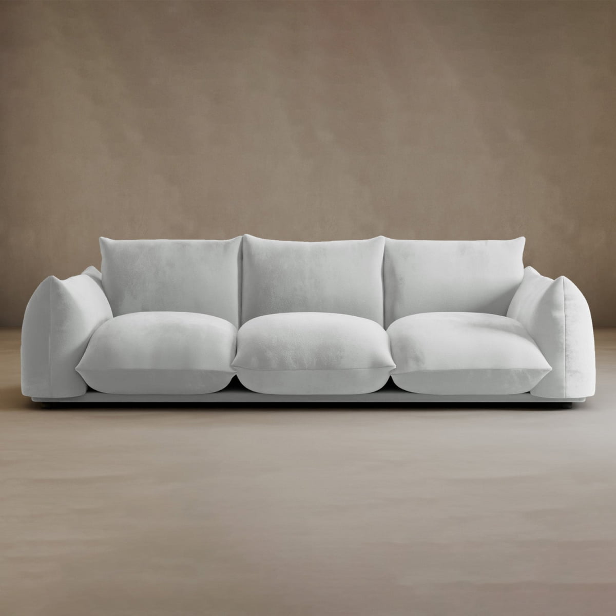 The Calypso Three Seater Sofa features plush, oversized cushions and soft, rounded armrests in a modern, low-profile design—making it the perfect statement piece for your living room.