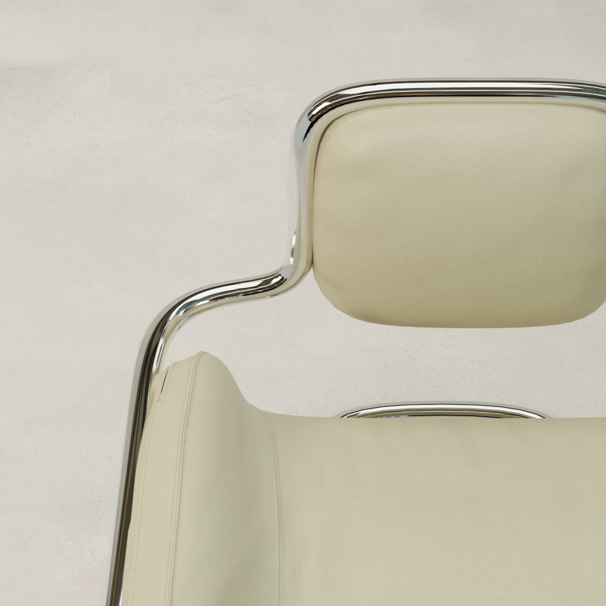 Close-up of the Citron Chair highlights its modern design, featuring a chrome frame and light beige cushioned seat and backrest, set against a pale neutral background.