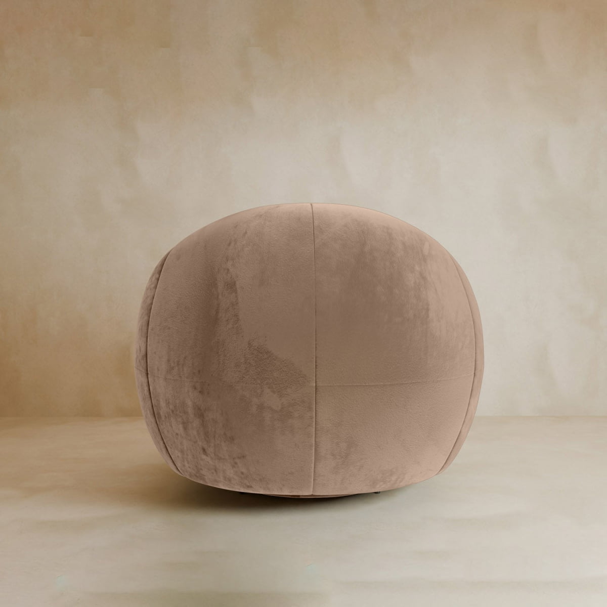 A beige Clara Armchair with soft velvet upholstery sits on a matching beige floor against a neutral, minimalist background.