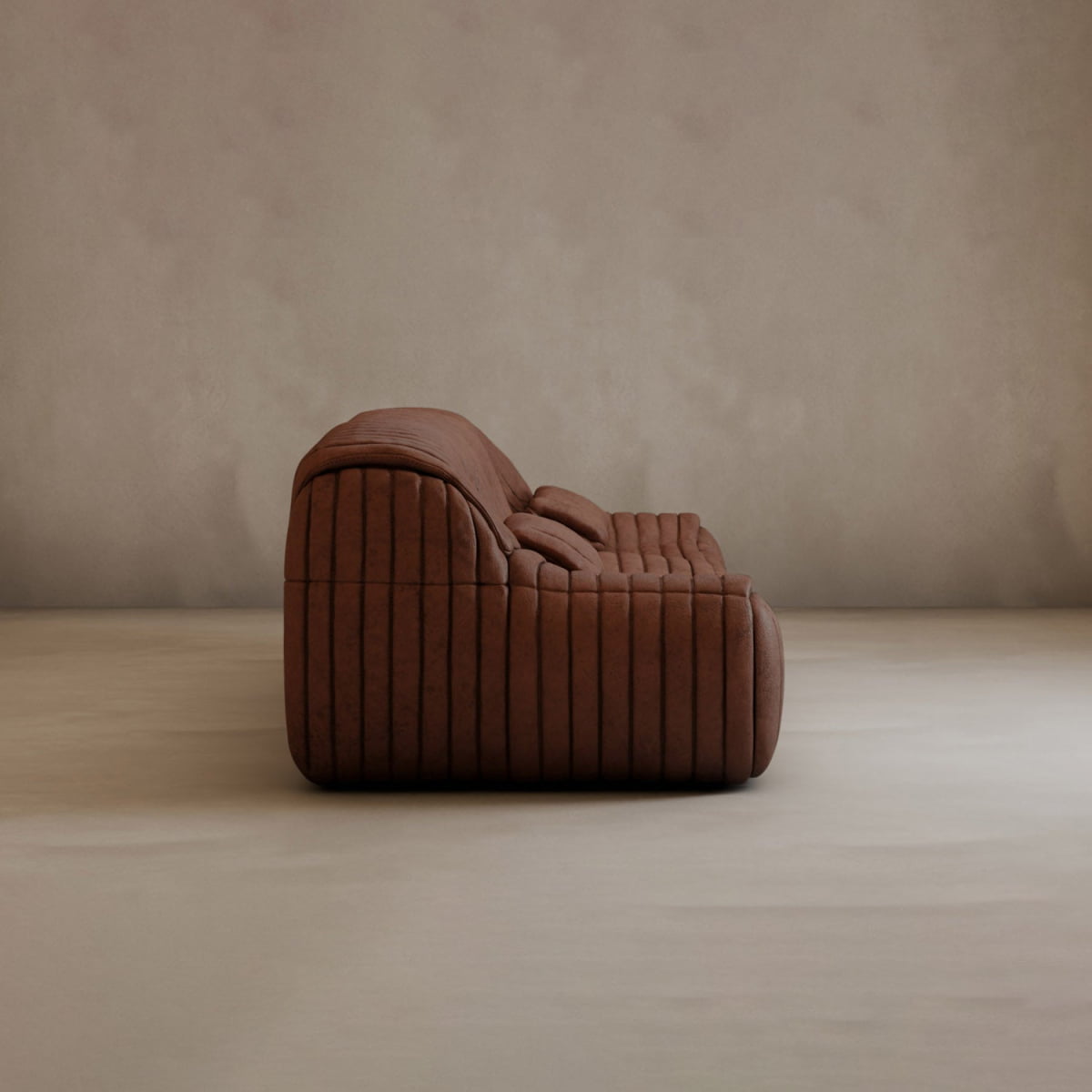 The Calypso Armchair, with a tufted stripe design, is a brown, modern, low-profile upholstered piece shown in profile view against a plain light beige wall and floor.