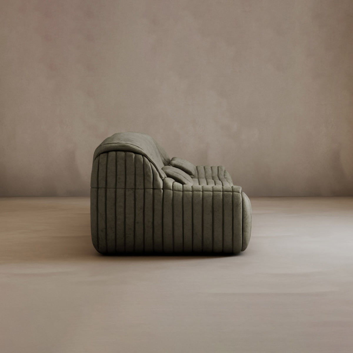 A contemporary Calypso Armchair with deep horizontal tufted stripes and soft olive green fabric rests alone on a neutral, smooth floor against a plain beige wall, viewed from the side.