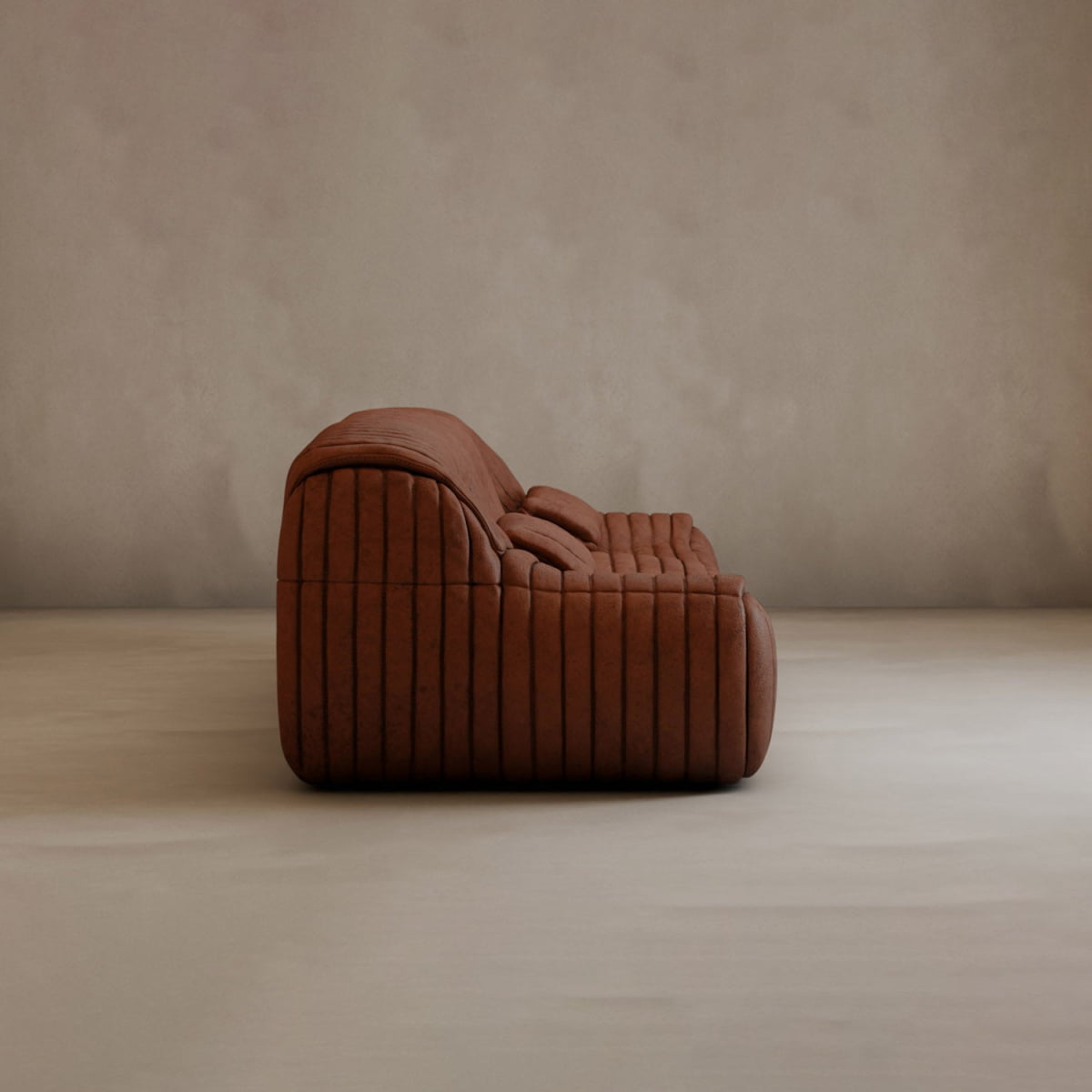 A modern, low-profile Calypso Armchair with vertical stitching and contemporary elegance, shown in profile against a plain, light-colored wall and floor.
