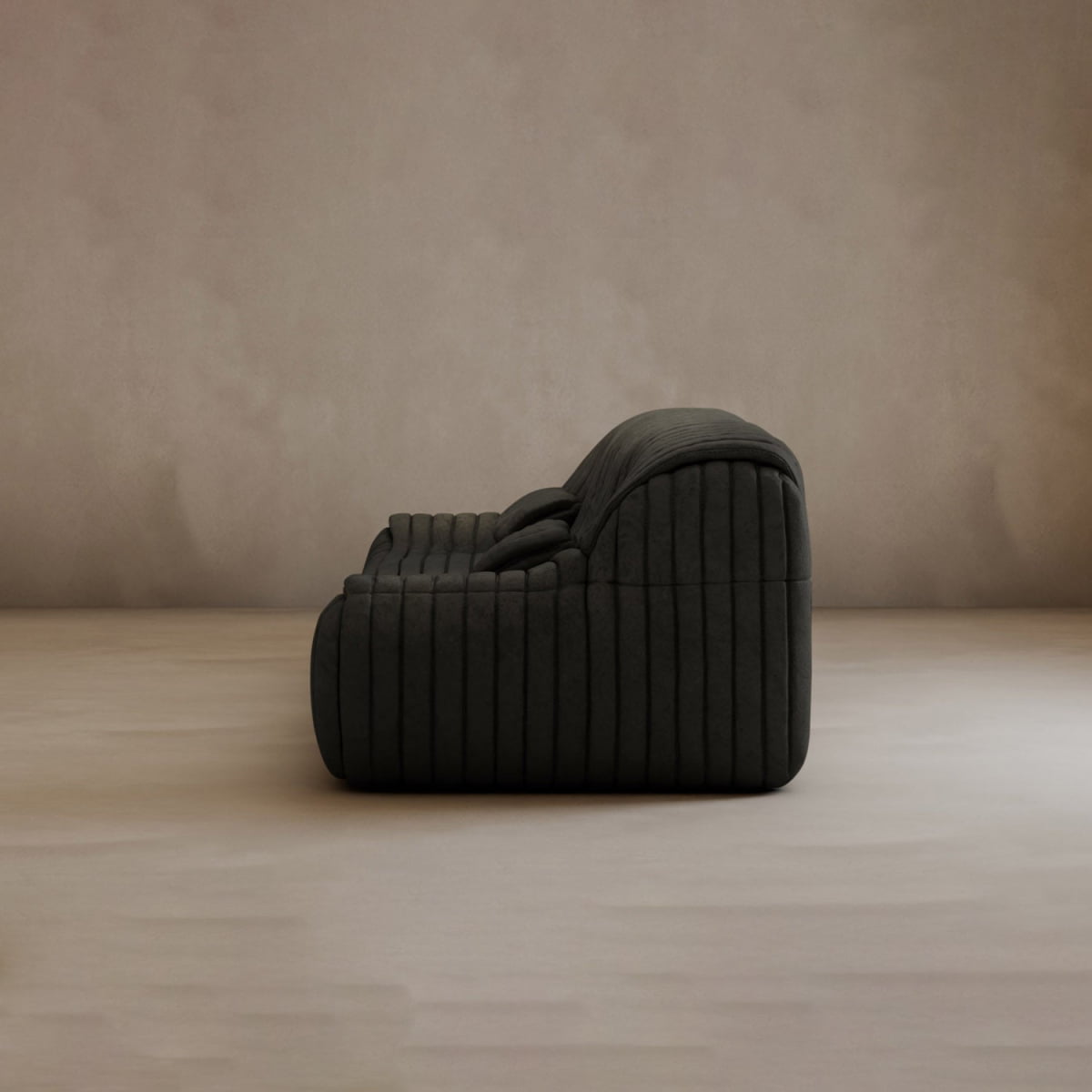 The Calypso Armchair, featuring a dark hue and tufted stripe design, is displayed side-on atop a light floor against a neutral textured wall—an embodiment of modern elegance.