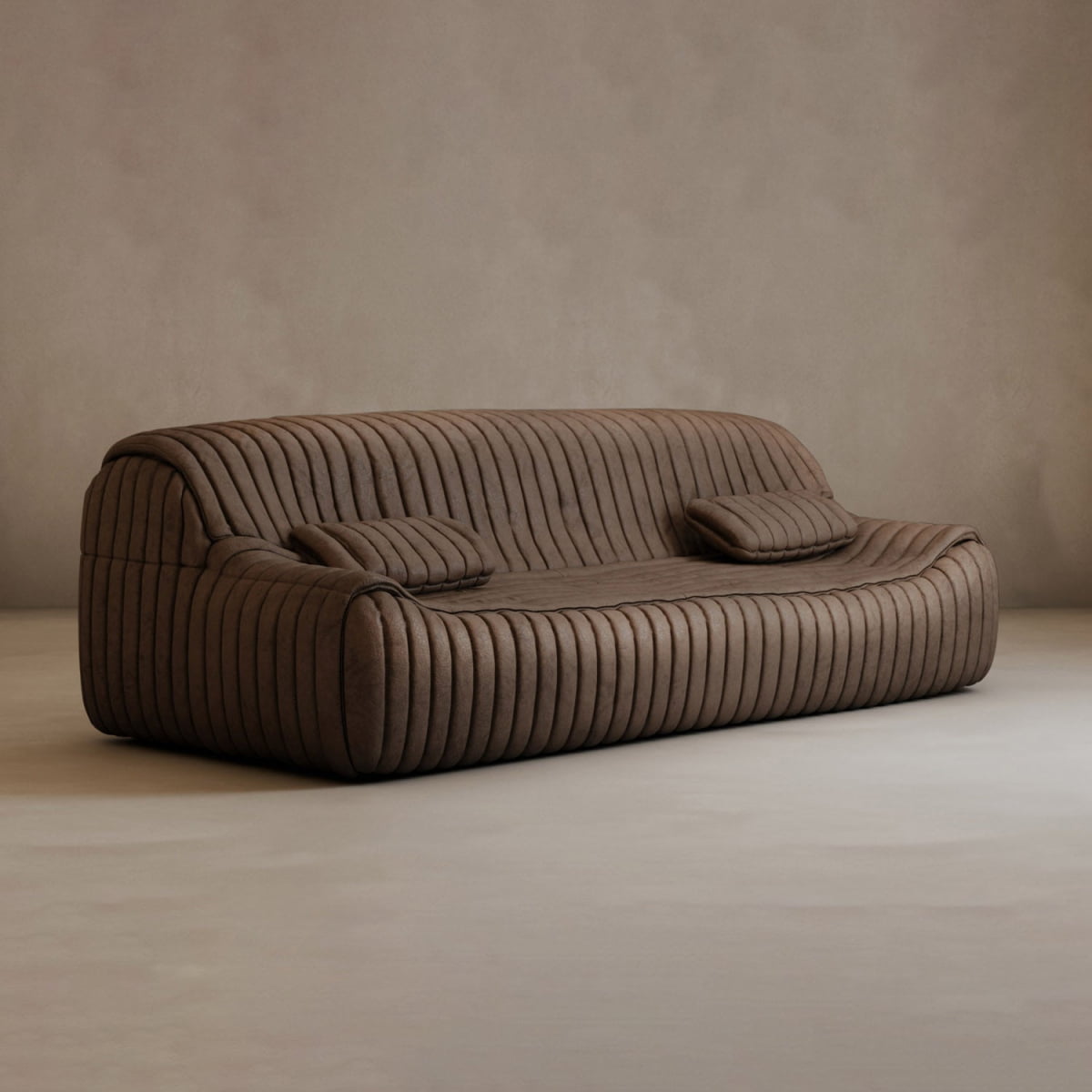 The Calypso Armchair with ribbed upholstery and two matching cushions adds modern elegance to a minimalist room with neutral walls and floors.