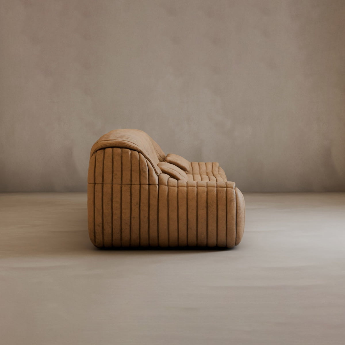 A modern tan suede Calypso Armchair with a low profile and tufted stripe design sits on a smooth, light-colored floor against a plain beige wall, radiating modern elegance.
