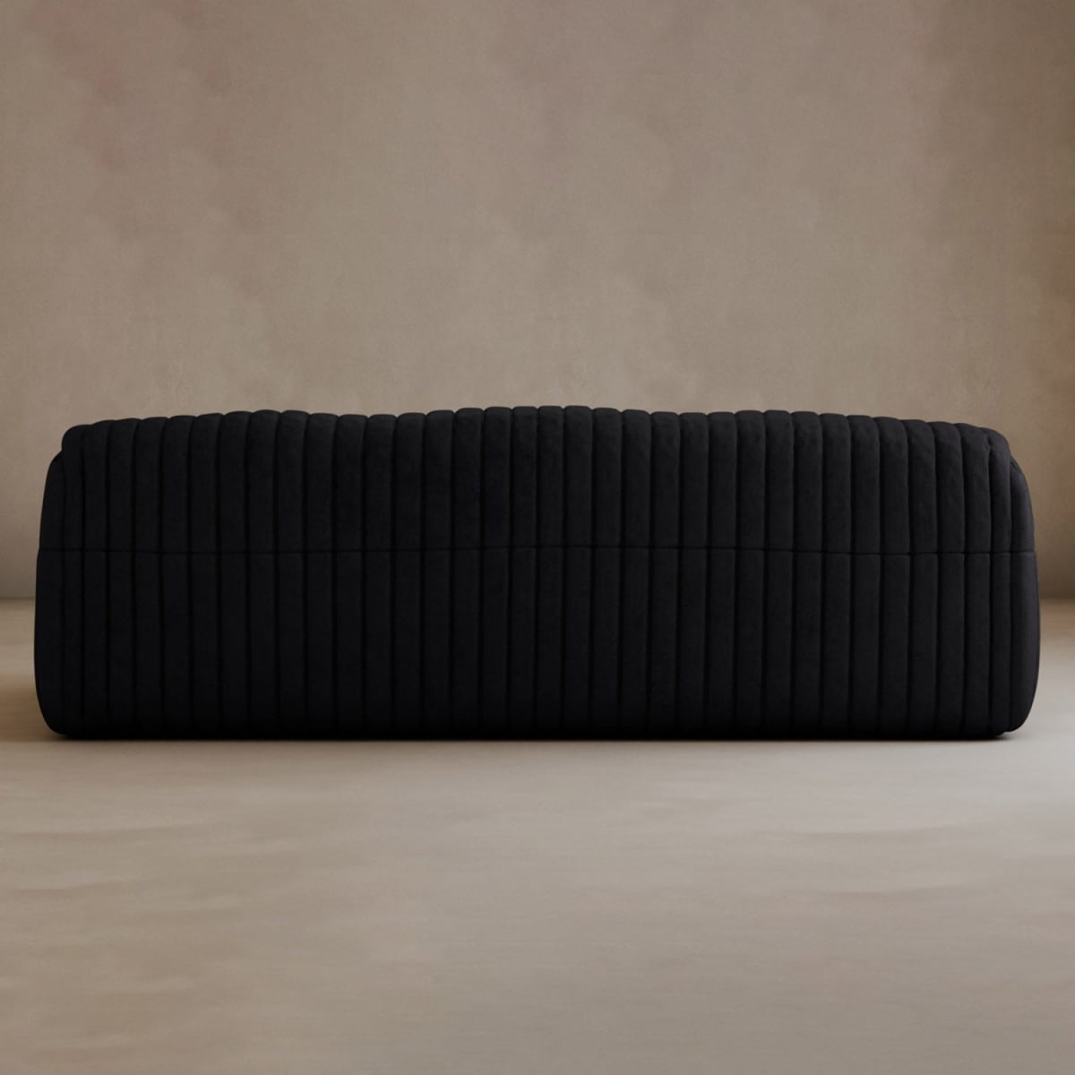 The Calypso Armchair showcases modern elegance with its tufted stripe design, featuring a large rectangular black silhouette. It is placed on a light-colored floor against a beige wall.