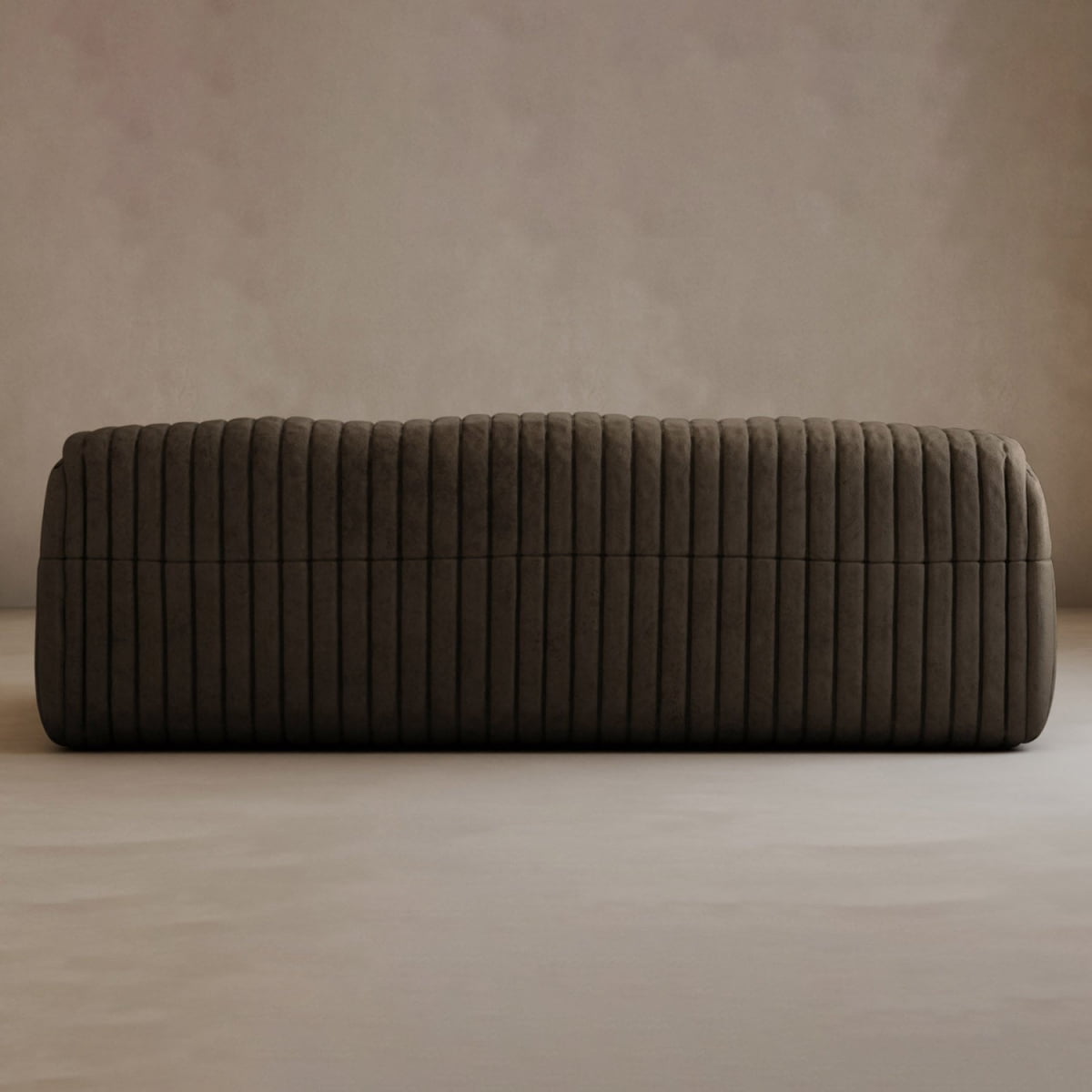 The Calypso Armchair, featuring modern elegance and vertical ribbed stitching in dark brown upholstery, rests on a light textured floor against a plain beige wall.