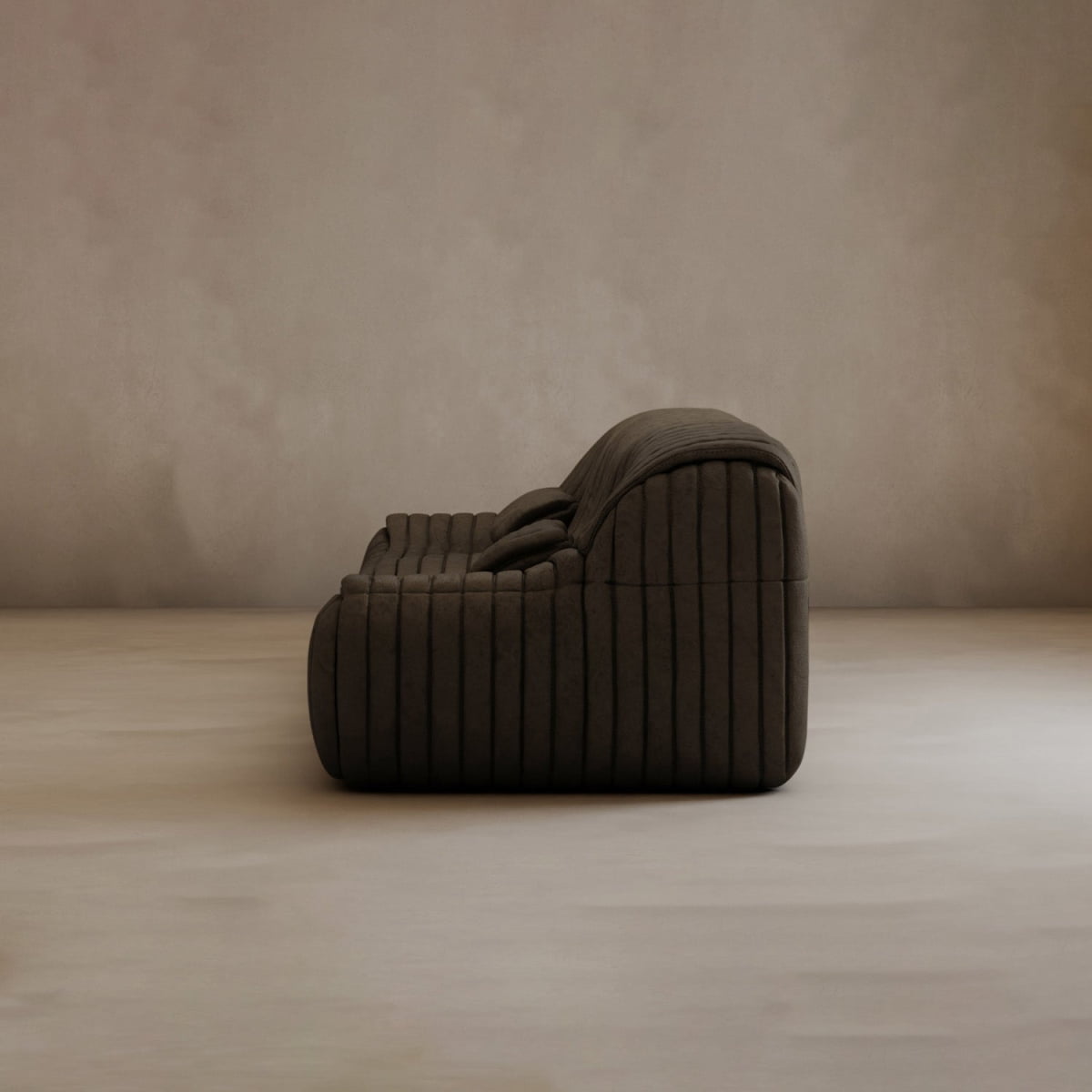 The Calypso Armchair, featuring a modern dark brown tufted stripe design, is displayed in profile against a plain light beige wall and floor, creating a minimalist and elegant atmosphere.