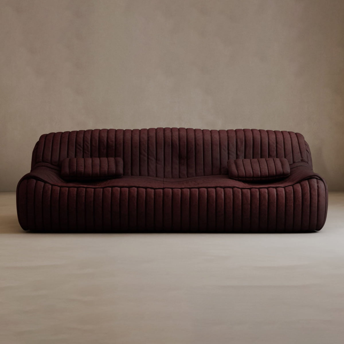 A modern elegance, the Calypso Armchair features a dark brown corduroy finish with tufted stripes, two matching cushions, and curved edges, set stylishly against a plain beige wall on a light floor.