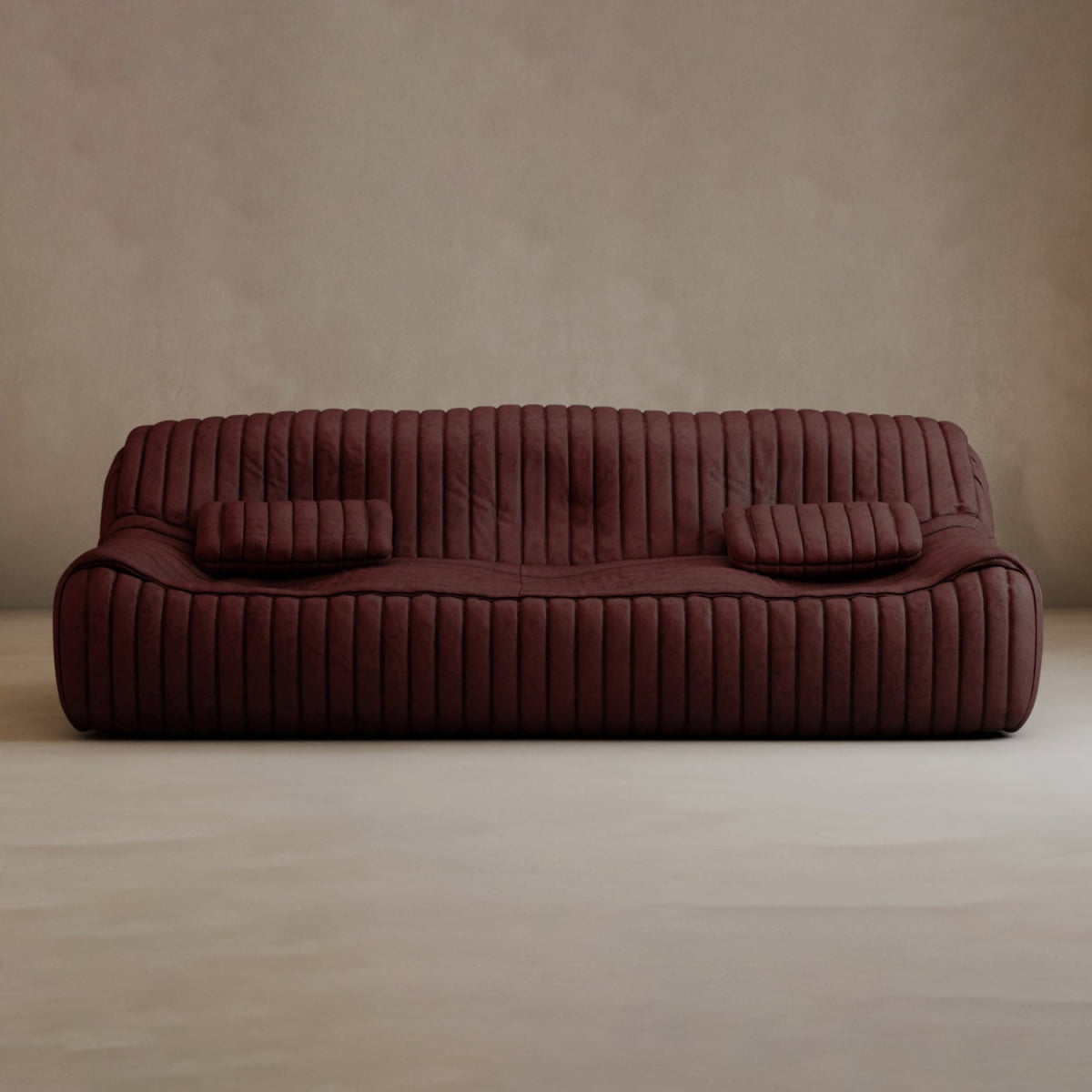 The Calypso Armchair exudes modern elegance with its deep burgundy color and low profile. Its tufted stripe design and two matching rectangular cushions make it a stylish accent against a plain beige wall.