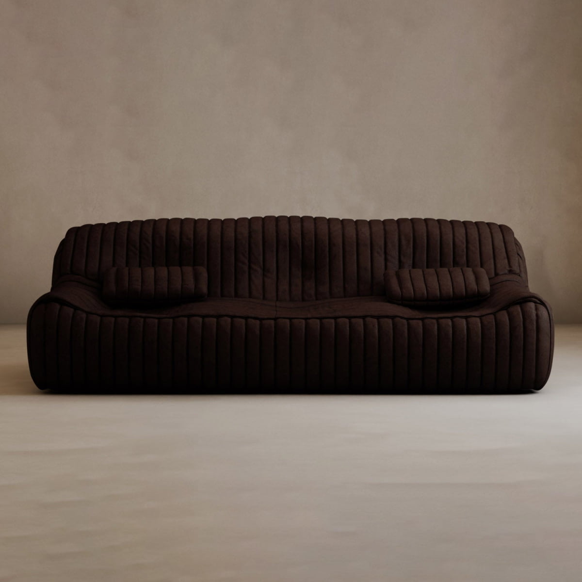 A dark brown Calypso Armchair with a tufted stripe design and two matching rectangular cushions sits against a plain, light beige wall in a minimalistic room, radiating modern elegance.