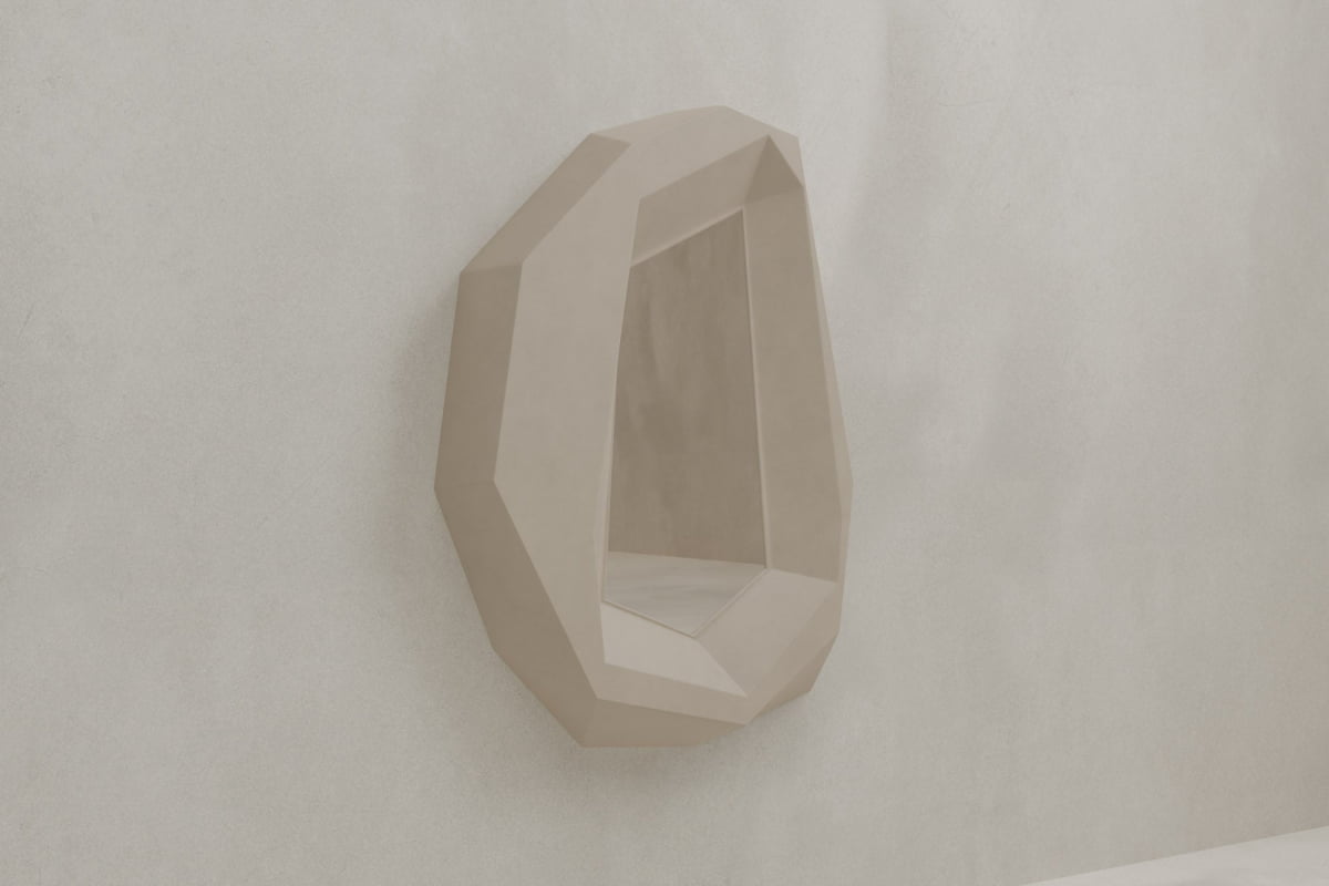 The Facet Mirror Large, with its geometric design and beige finish, adds modern sophistication to a light textured wall.