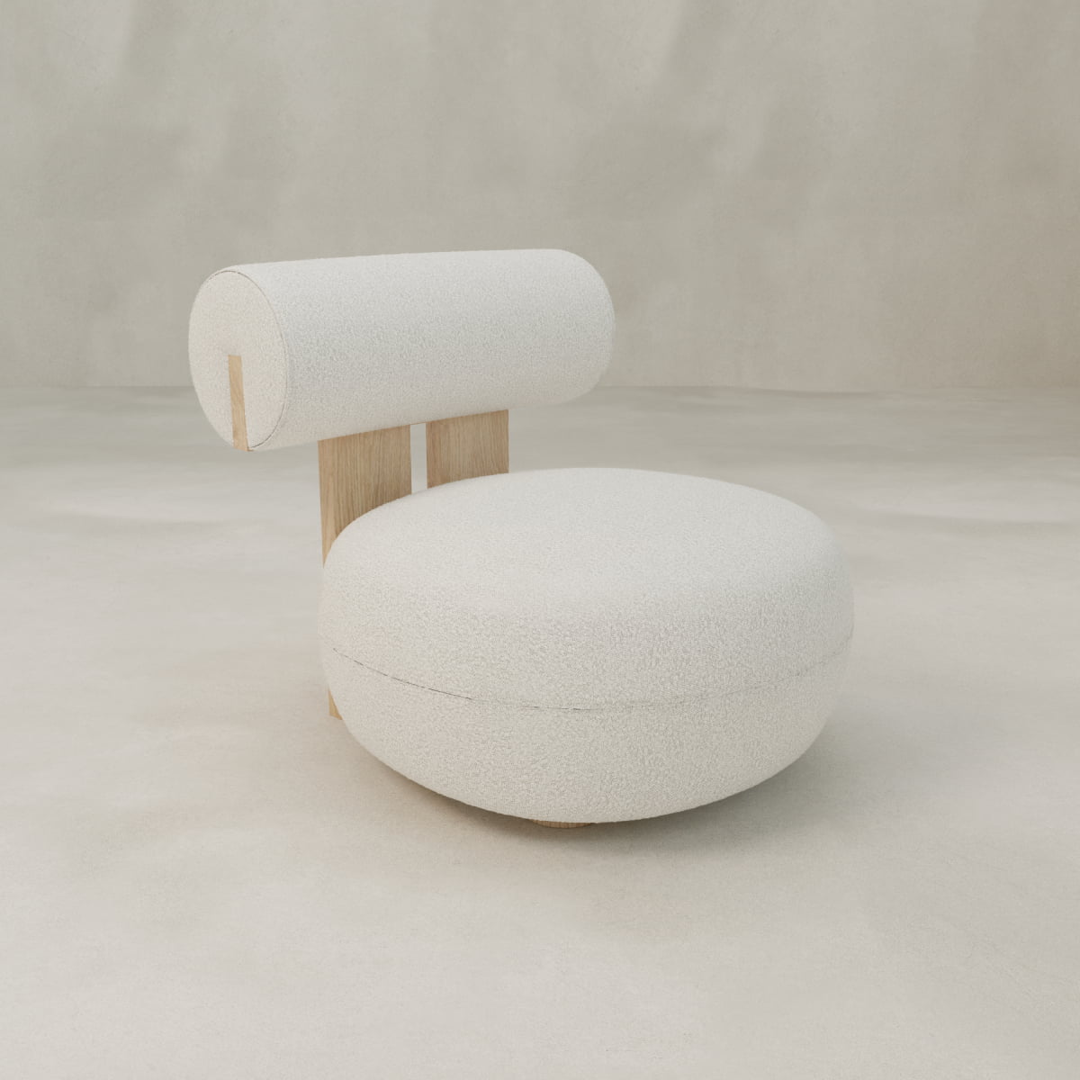 The Finchley Chair is a modern, minimalist seat with a round white cushioned seat, cylindrical backrest, solid legs, and light wood accents, all set against a neutral background.